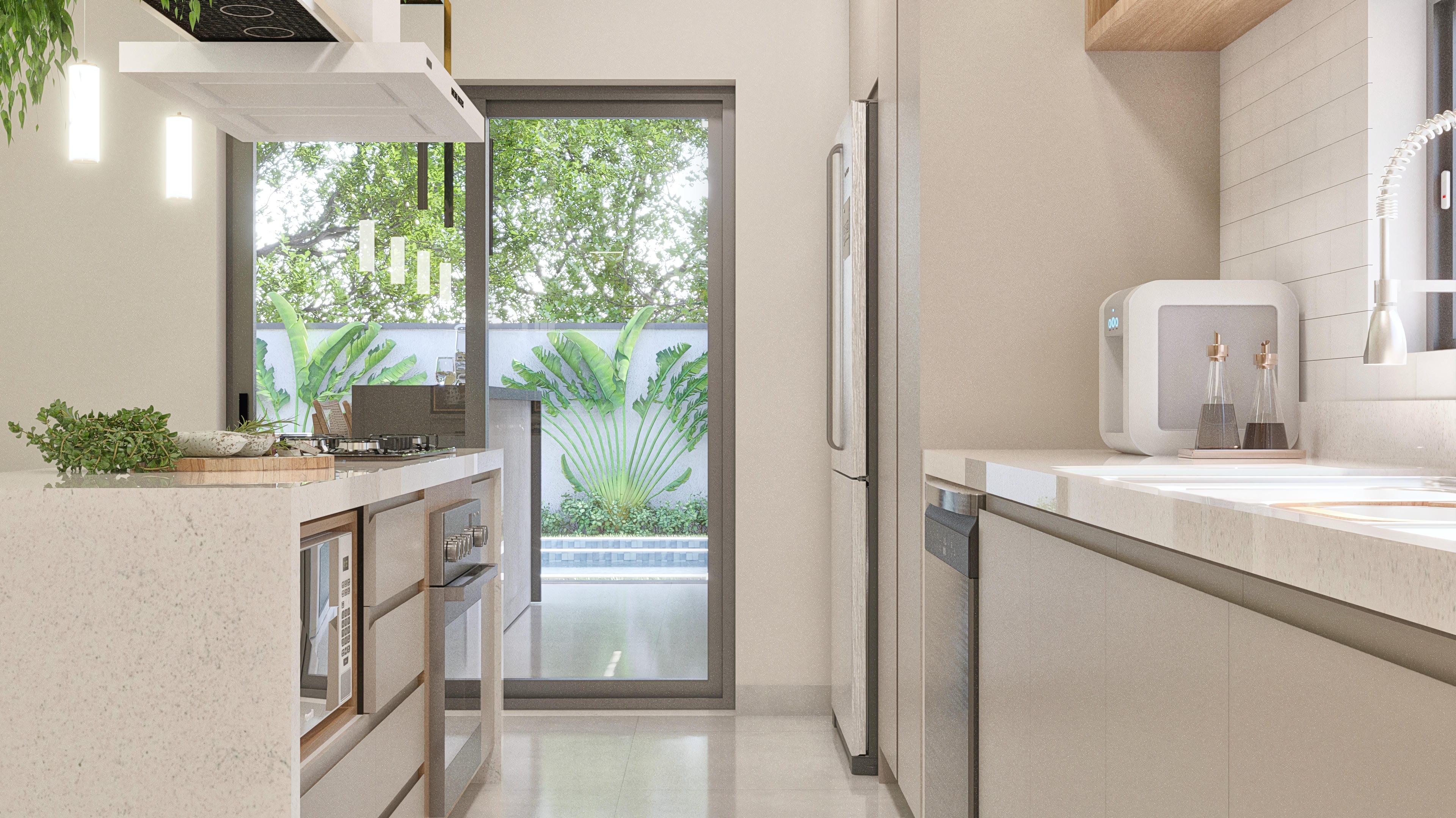 Interior of a modern and sophisticated kitchen with a light stone countertop, neutral-toned cabinets, and built-in appliances, featuring a wide view to the outdoor area with a pool and lush vegetation.