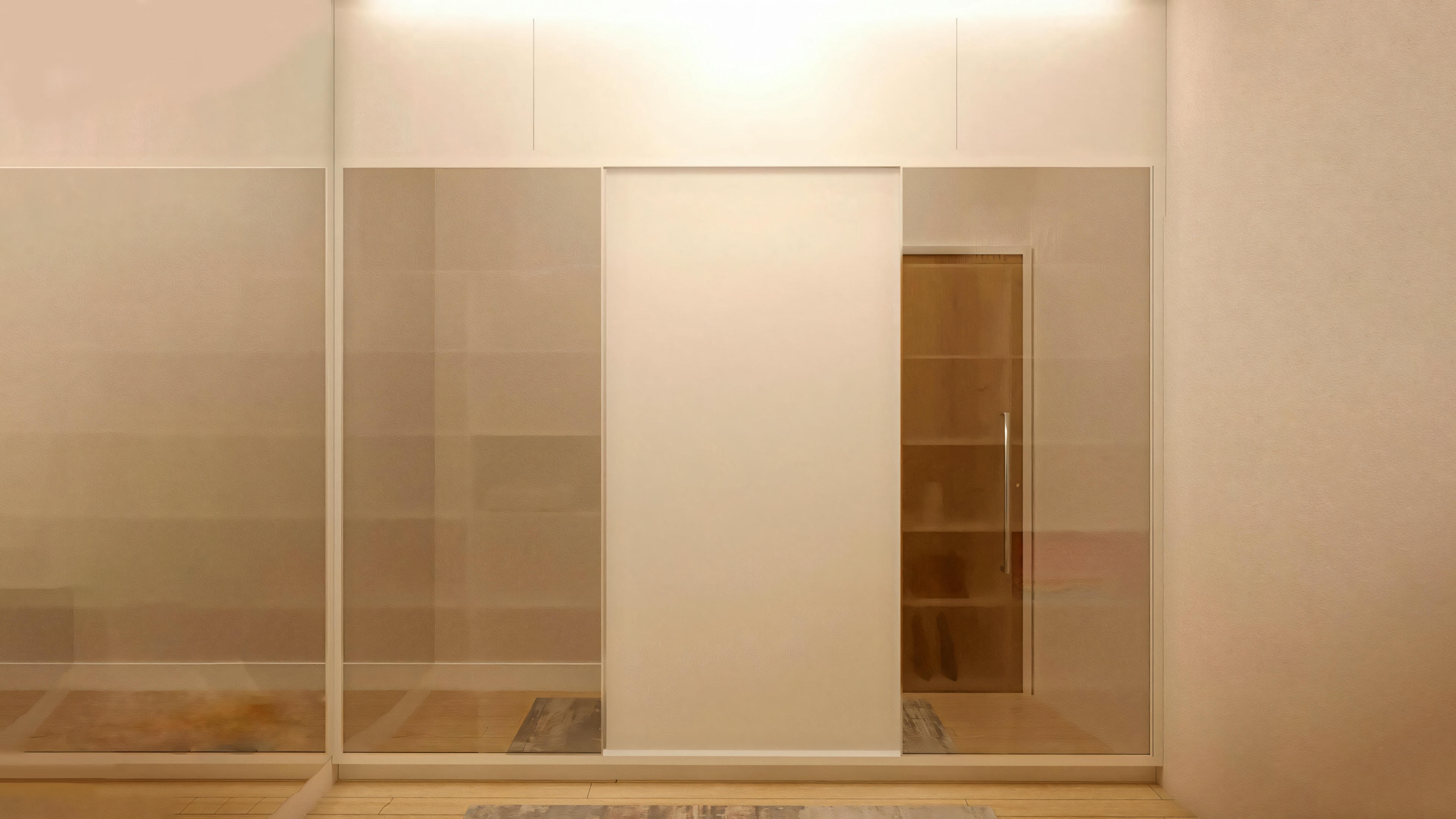 Section of a building with a beige wall and a sliding glass door or window.