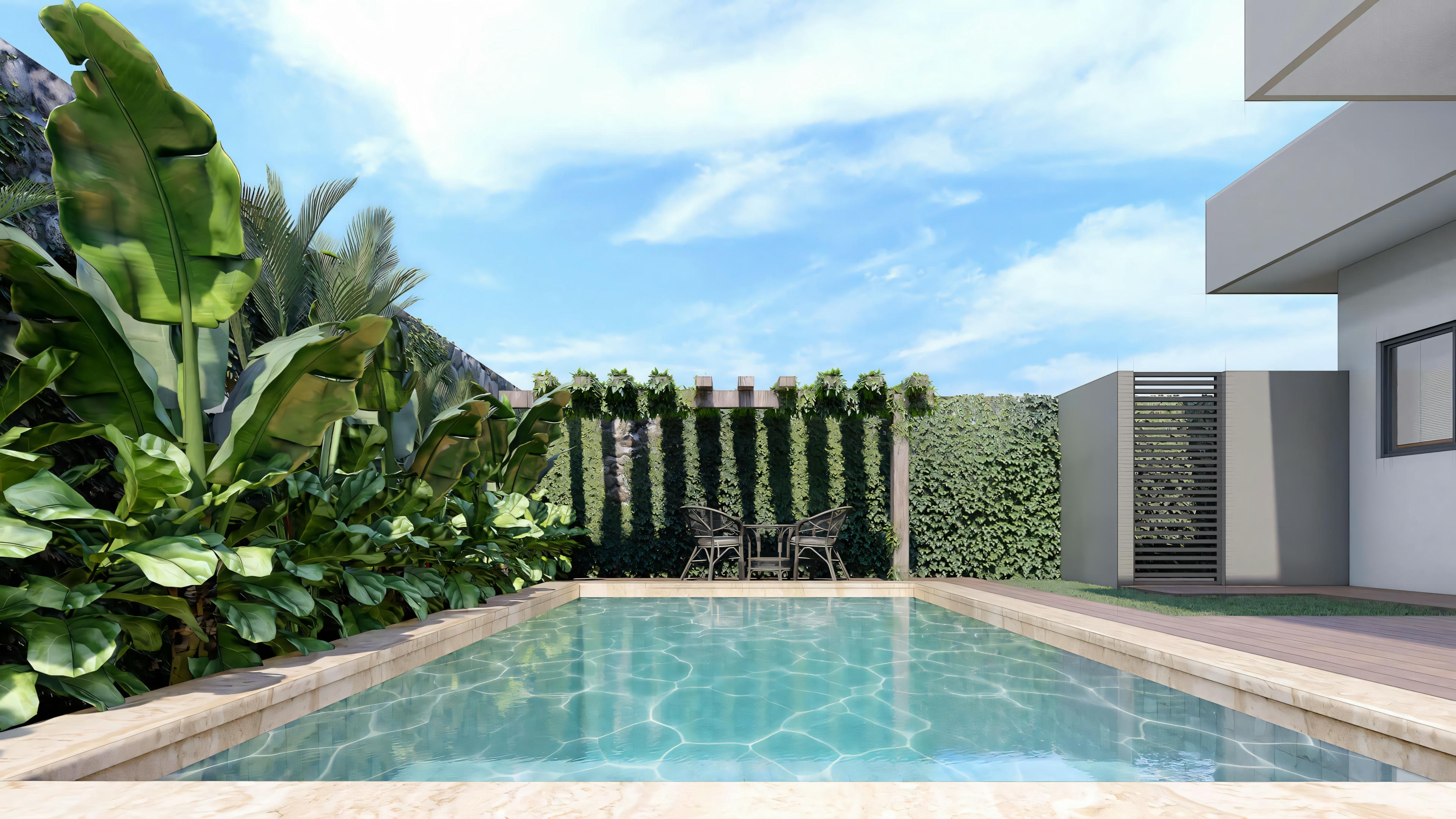 A pool with clear blue water, surrounded by a tile deck and green plants, with part of the house visible in the background.