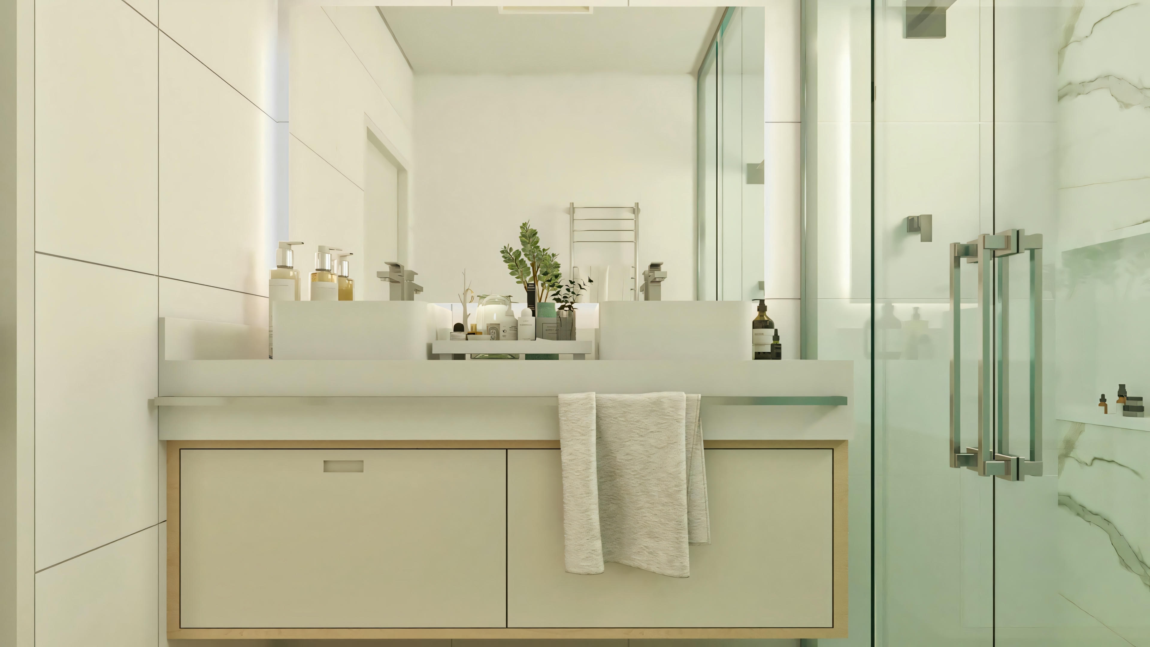 Baño de la suite matrimonial/principal en la casa de una planta de 3 habitaciones. Detalle de la encimera con lavabo doble de apoyo, armario suspendido claro, espejo amplio y box con revestimiento marmolado.