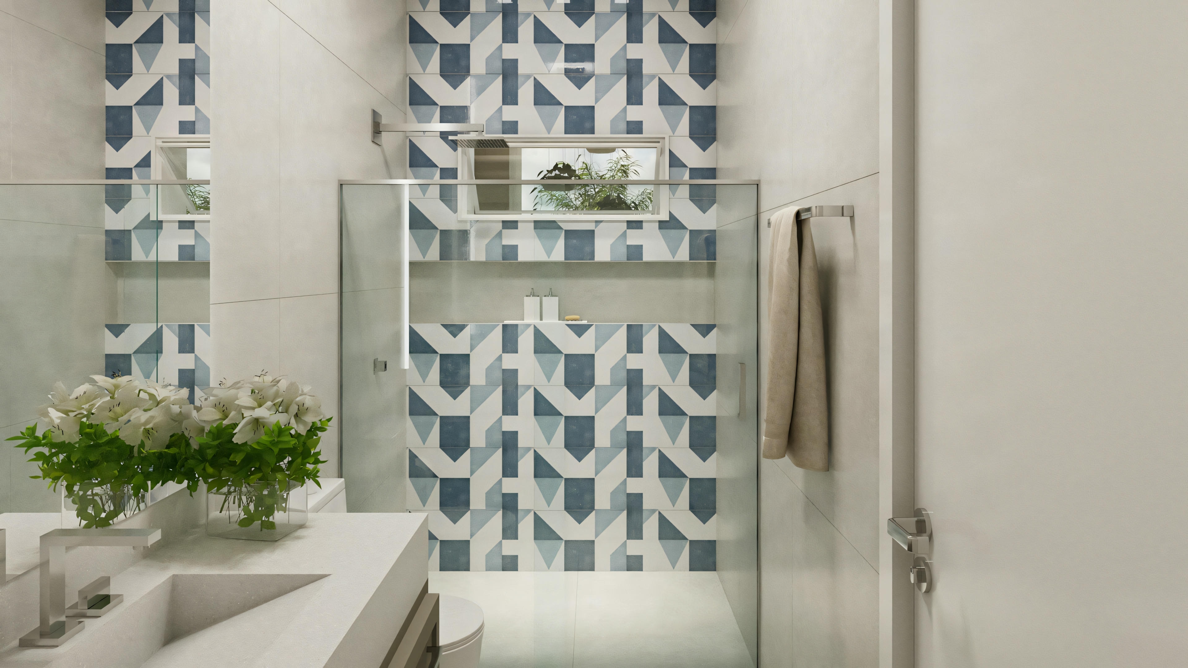 A modern bathroom with a glass shower enclosure and distinctly patterned tiles on the wall.