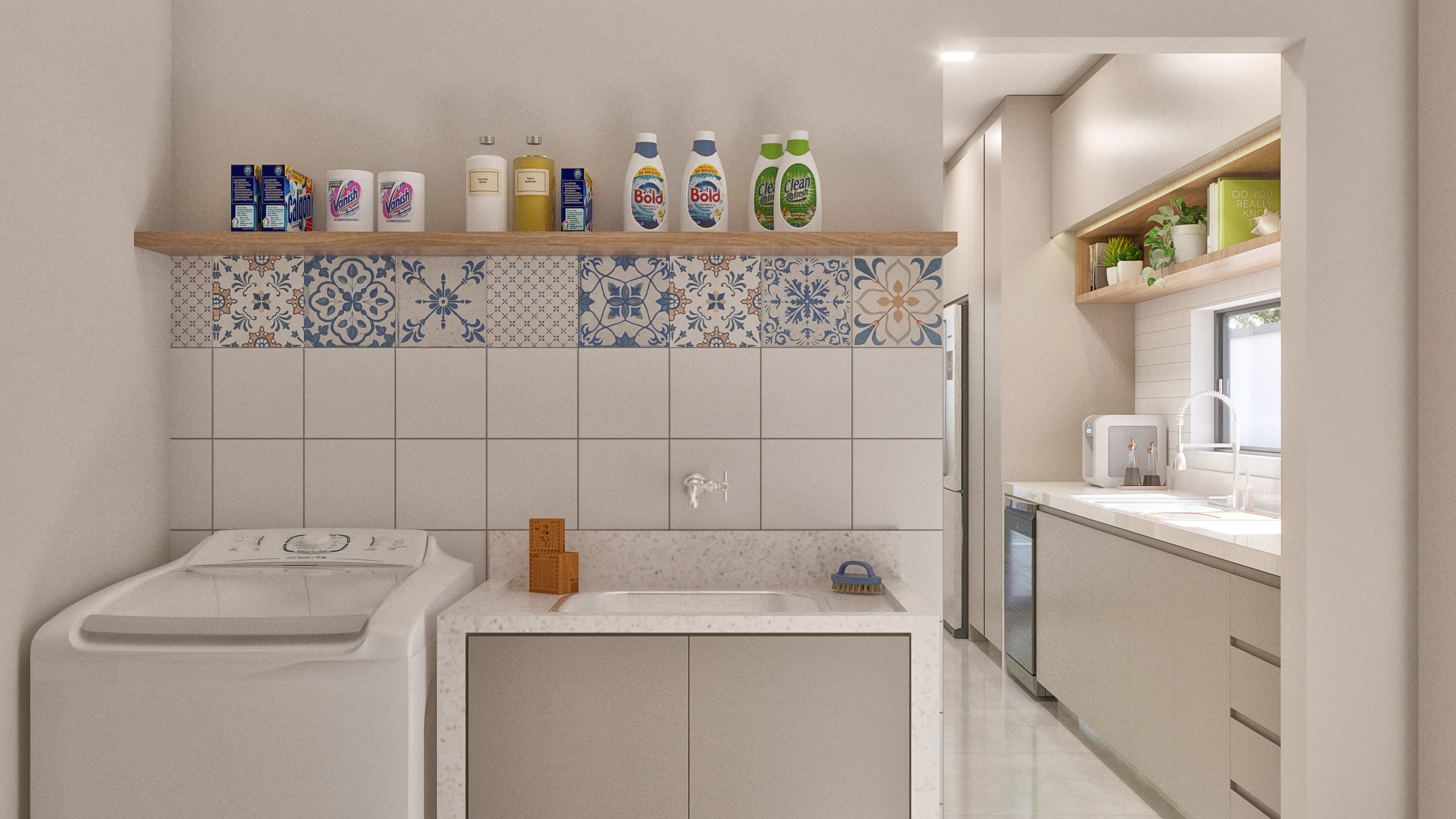 Lavandería con encimera de granito, armarios a medida, electrodomésticos y detalles en azulejos decorativos.