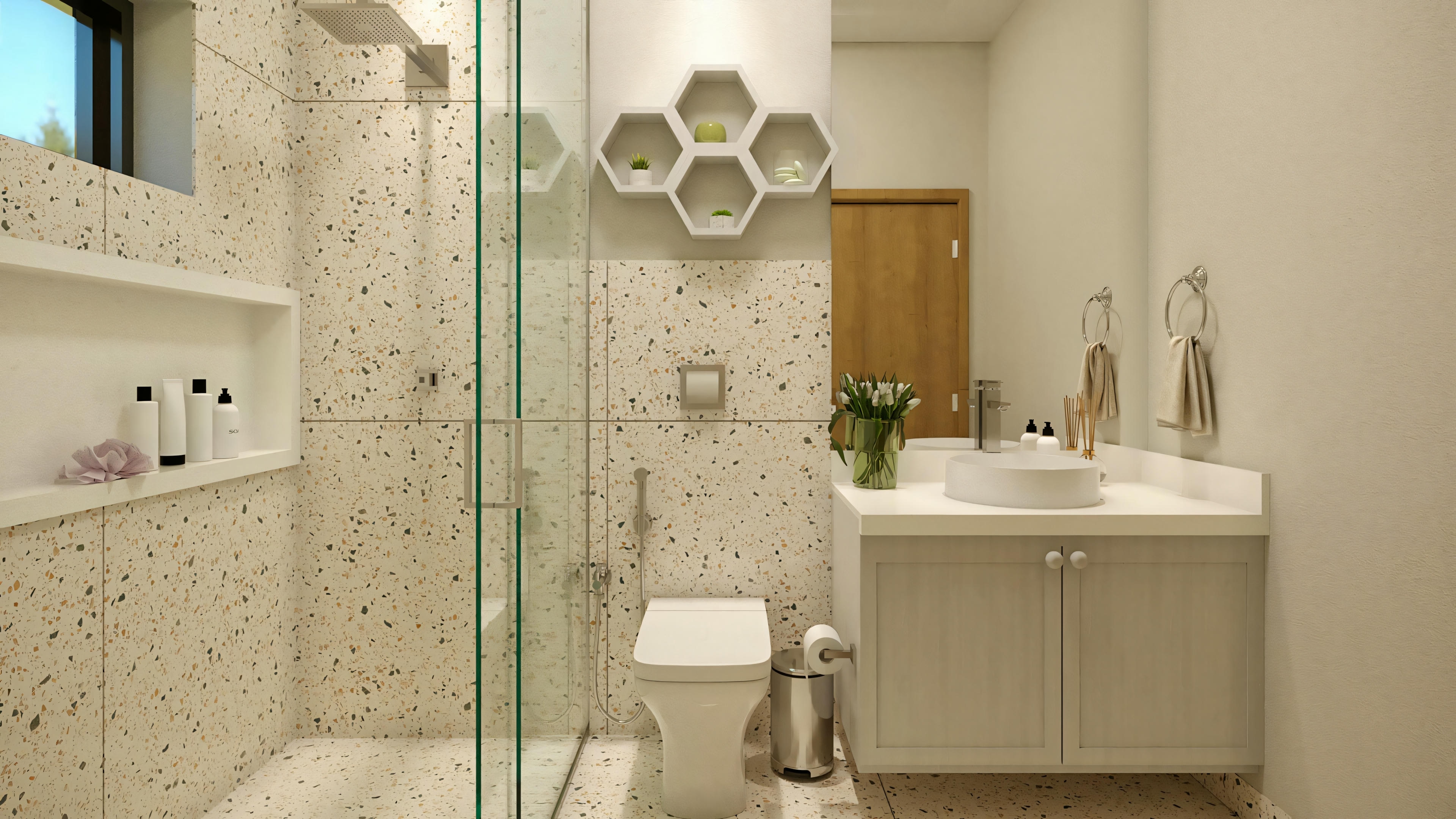 A bathroom with a glass shower enclosure, a white sink with a mirror above it, and decorative items on the wall.