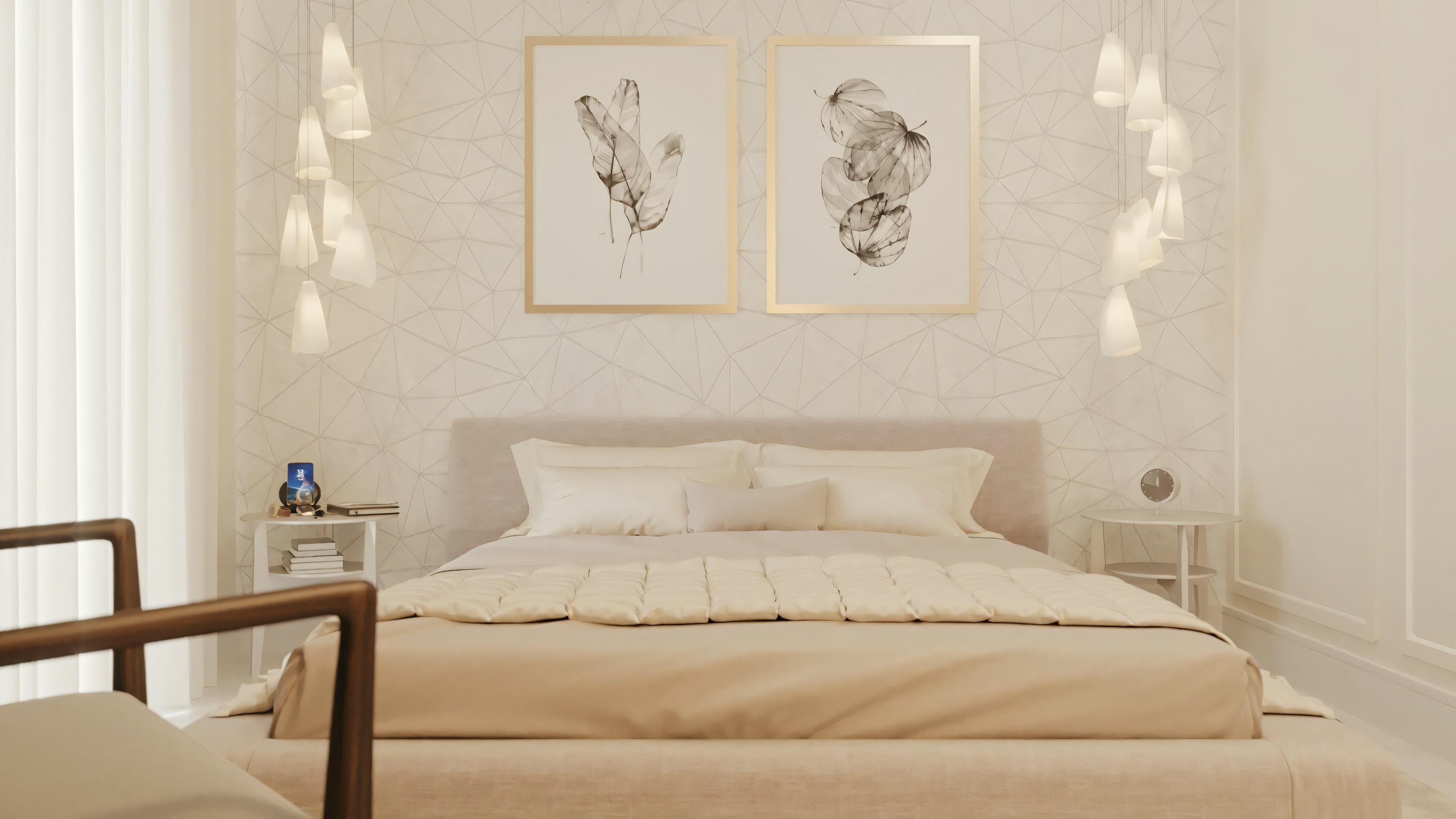 A bedroom with a neatly made bed, two framed pictures above the headboard, and a side table with a small blue object that could be a decorative item or a lamp.