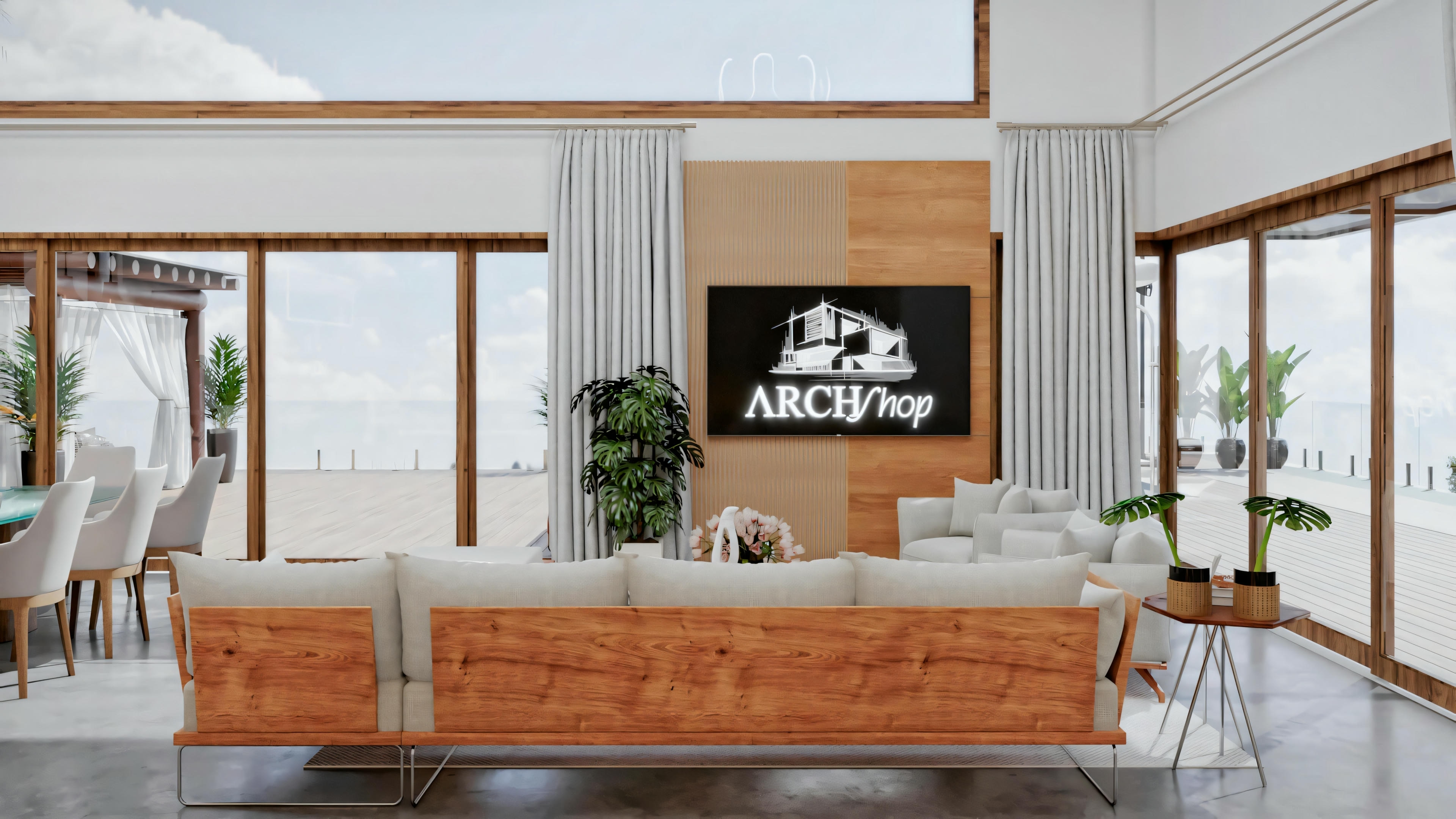 A living room with a sofa, chairs, coffee table, and television. The room has large windows overlooking the ocean and incorporates earthy tones with green accents.