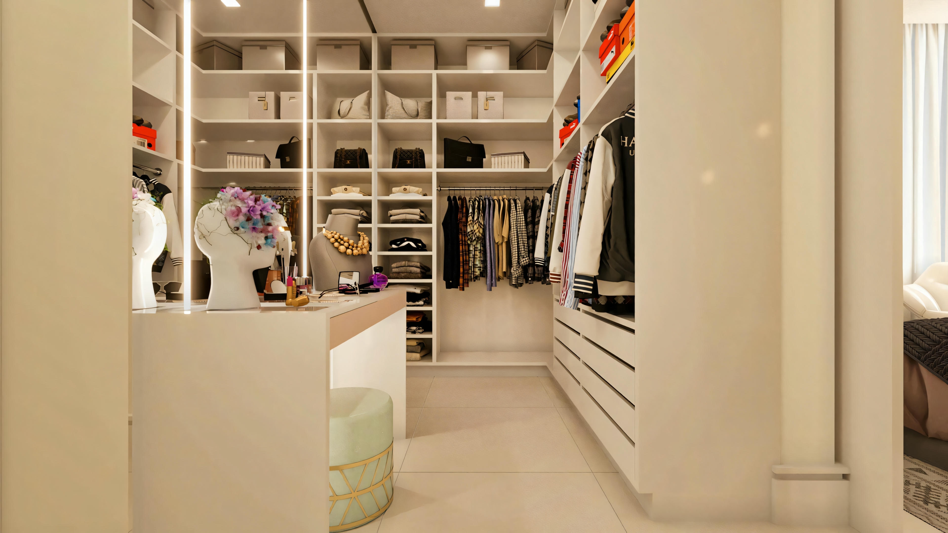 Walk-in closet of the master suite in a 3-bedroom ranch house. White planned cabinets with niches, shelves, drawers, hanger areas, and central island with countertop.