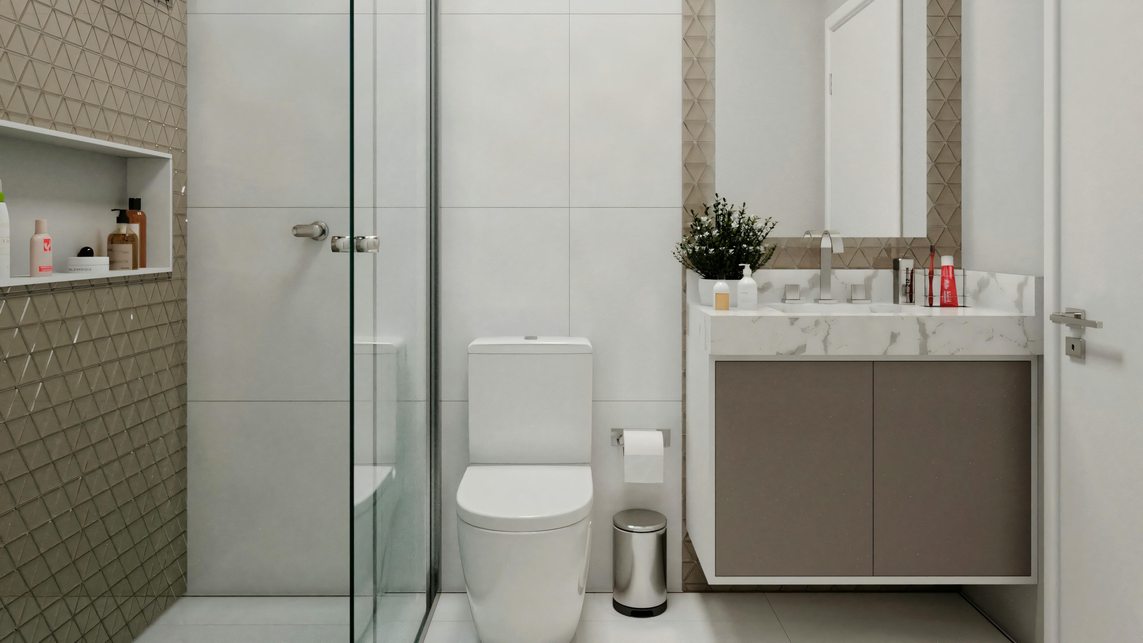 Modern bathroom with beige tiles on the walls, a glass shower enclosure to the right, a white toilet next to it, and a sink with a cabinet in the foreground. To the left, there is open shelving with various items.