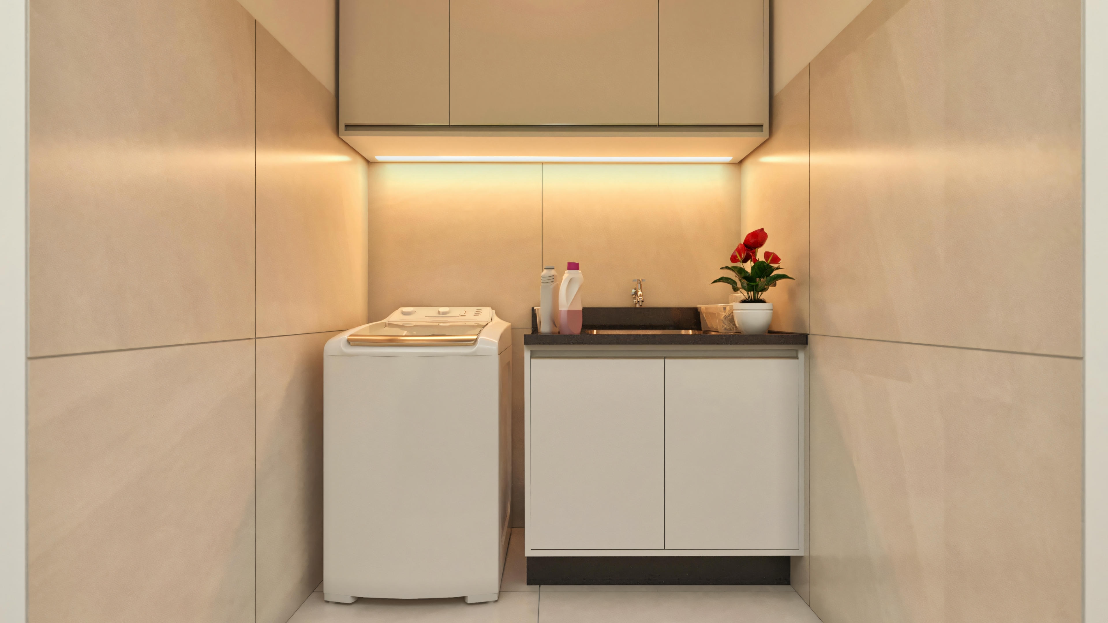 Área de serviço compacta e funcional de uma casa moderna com 3 quartos, equipada com máquina de lavar, tanque com gabinete, e armários suspensos. Revestimento em porcelanato claro e iluminação embutida.
