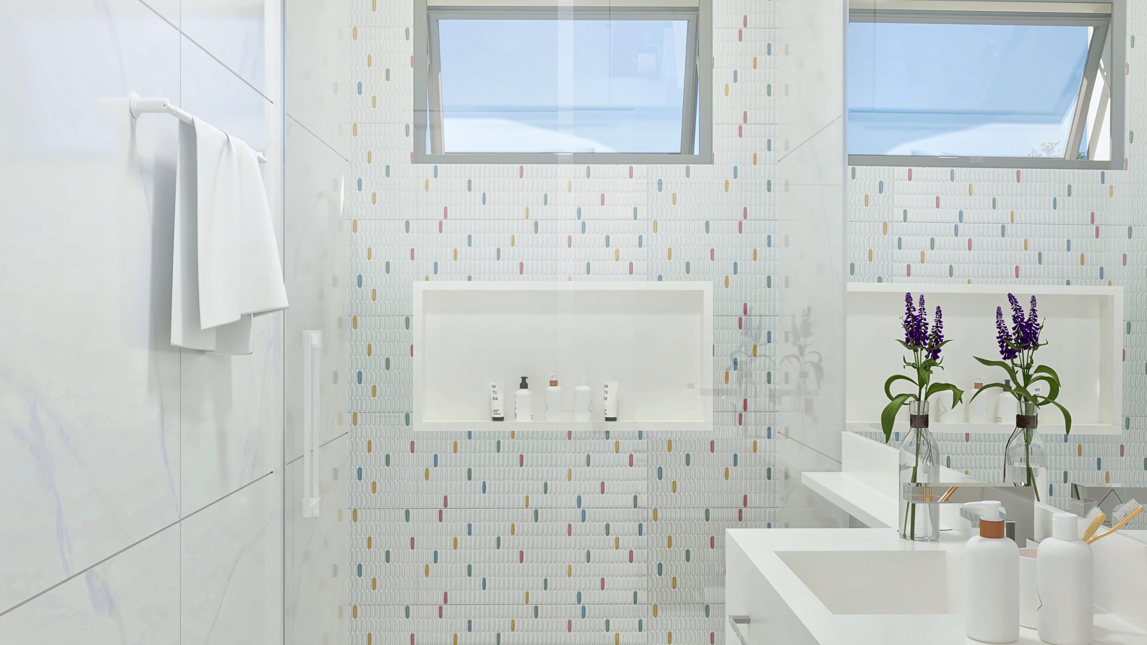 Detail of a modern bathroom with walls covered in white tiles with colorful details and a niche with hygiene products and plants.