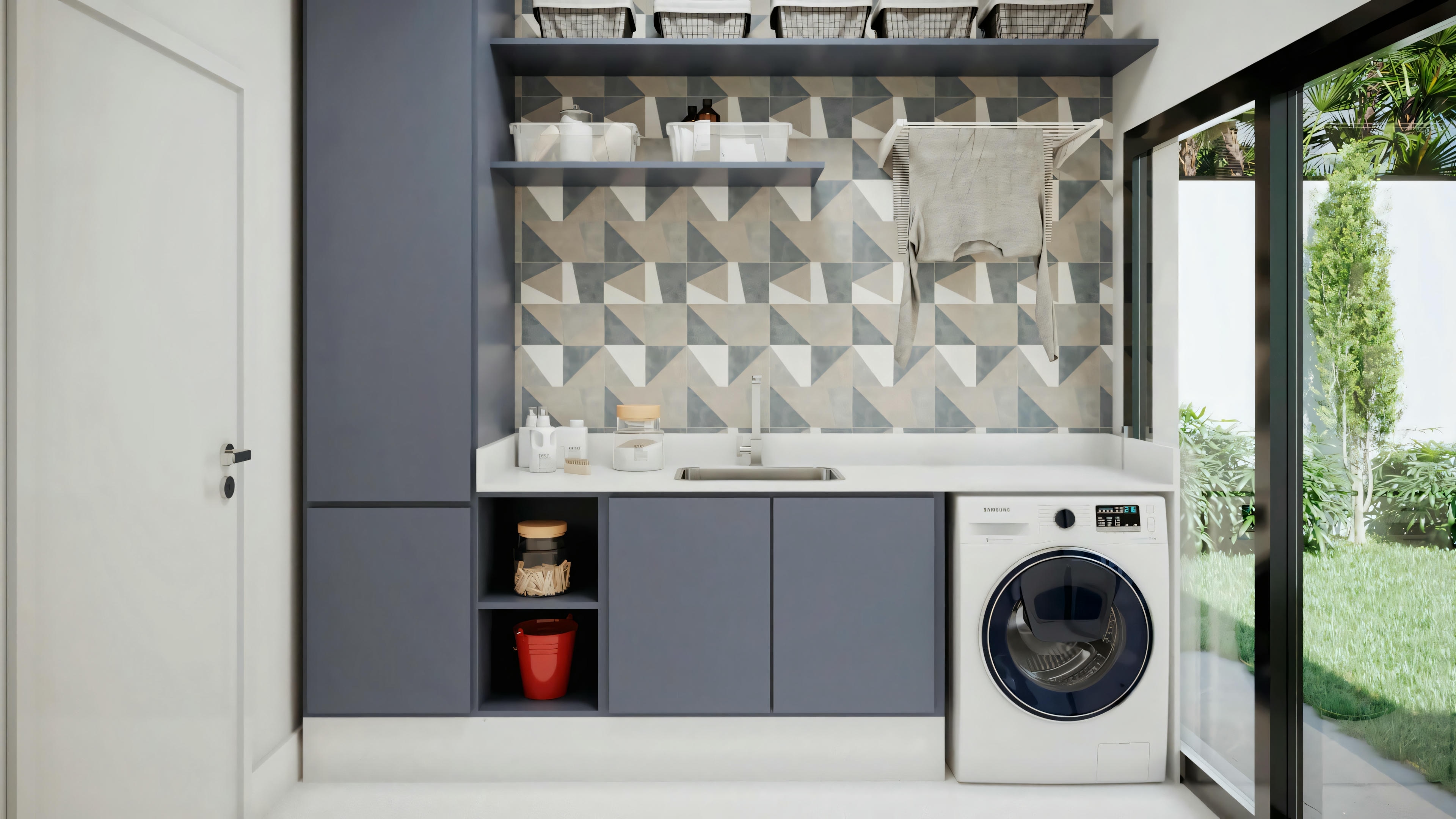 Uma lavanderia moderna com máquina de lavar, secadora empilhada e backsplash com padrão.