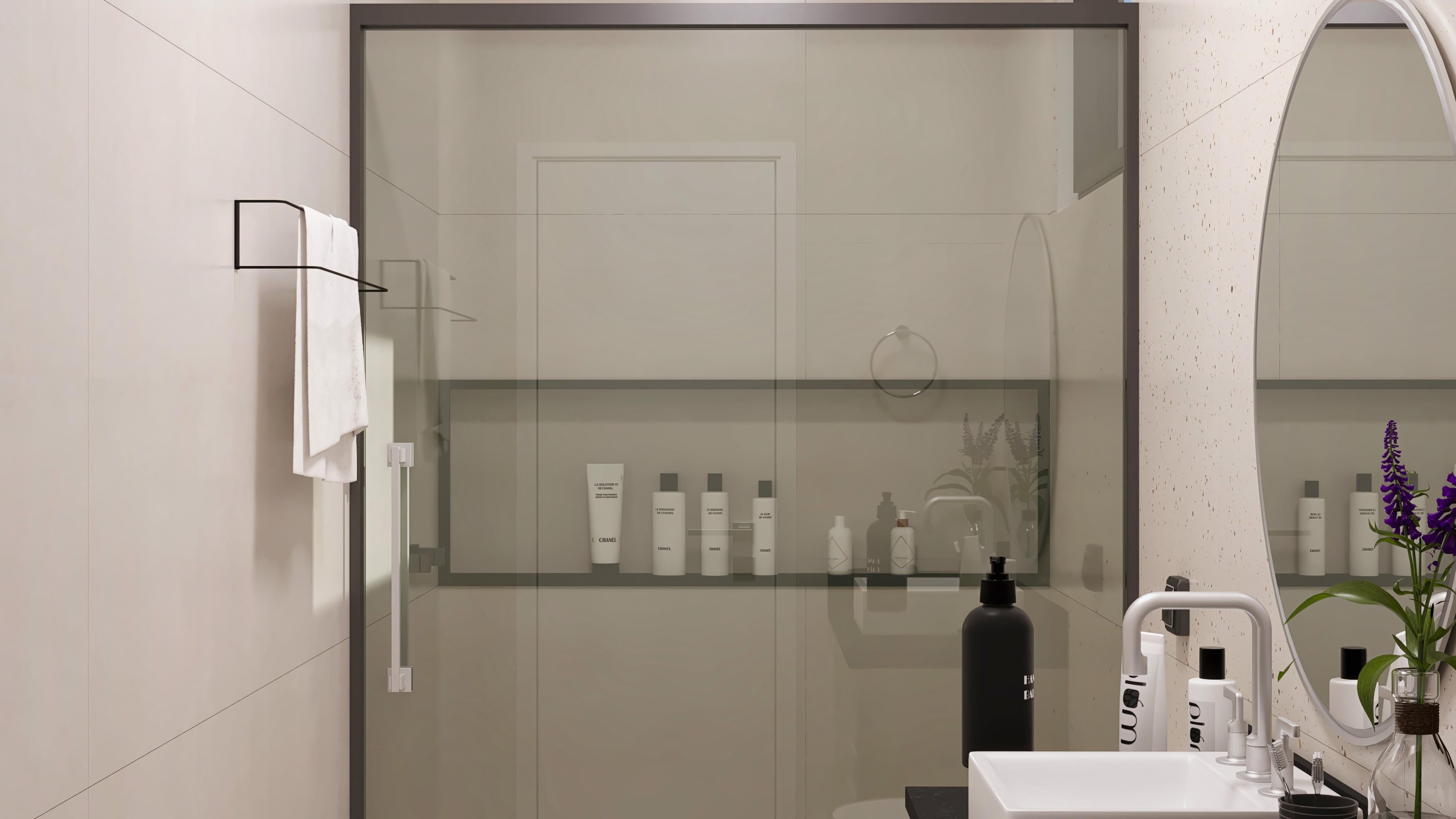 Details of a modern bathroom with stone texture cladding and large glass panels. A niche with hygiene products and a rounded mirror complete the room.
