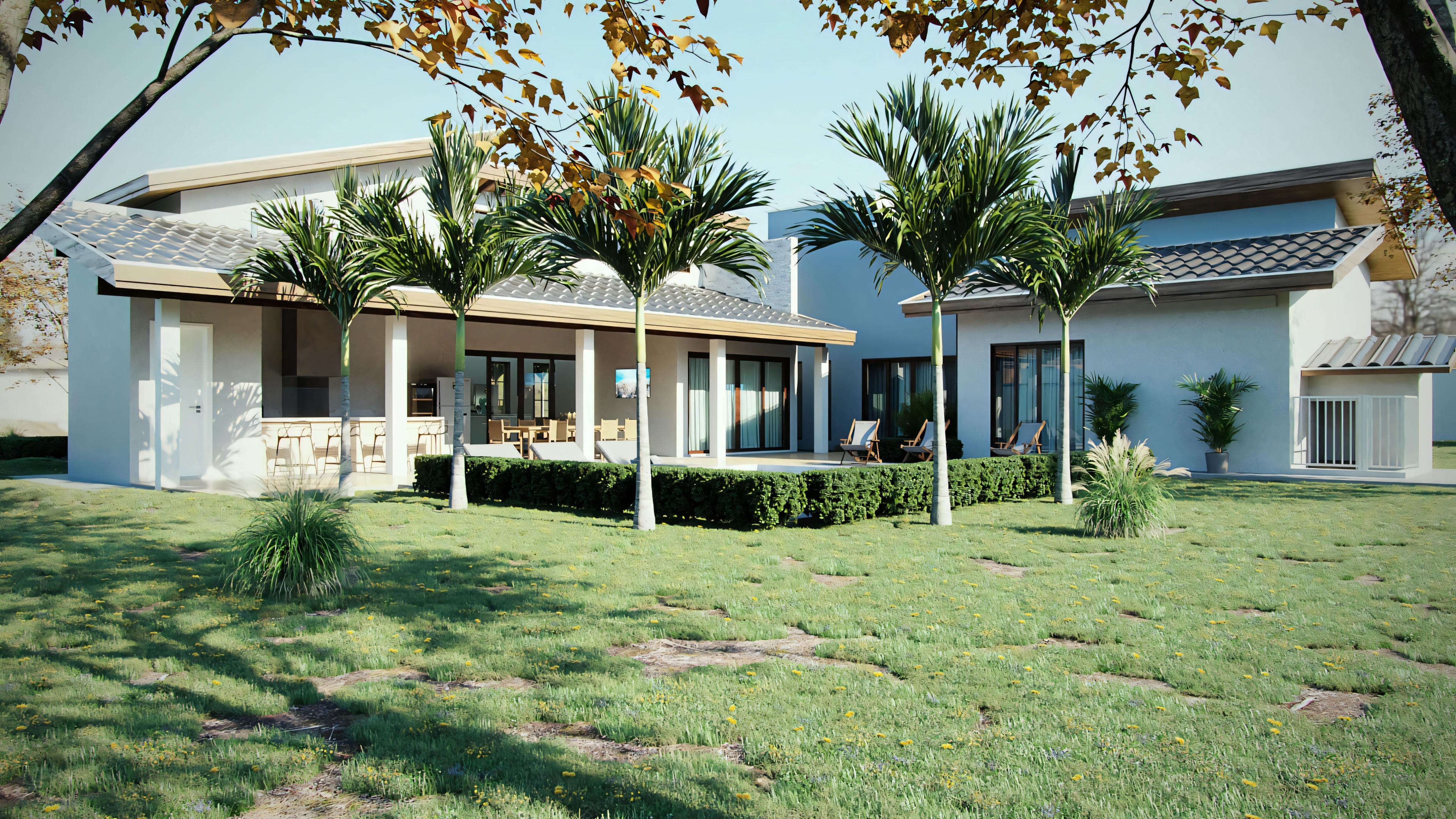 A single-story residential building with a lawn in front, white exterior, several windows, and a tile roof.