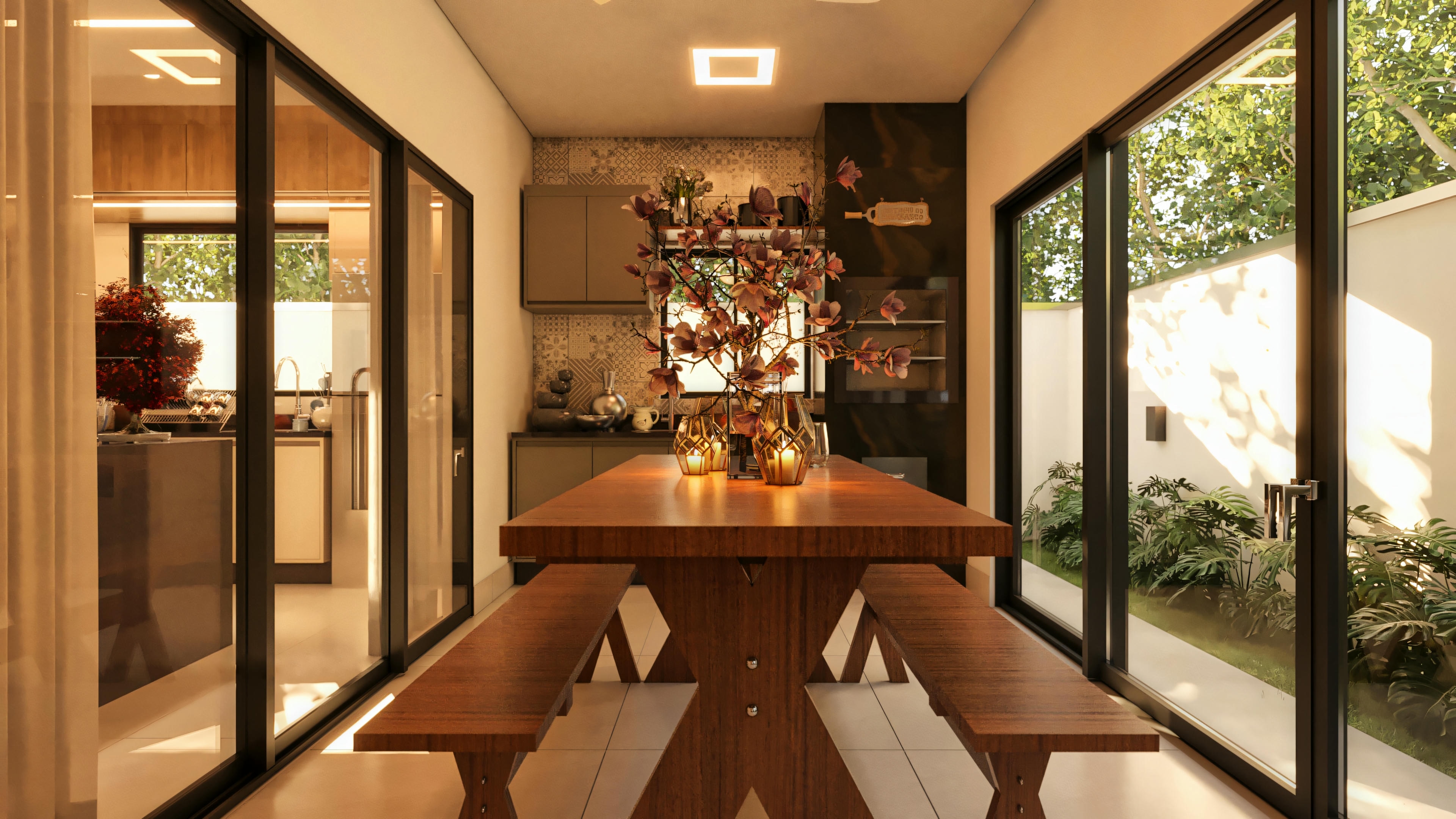 Área gourmet de casa moderna com 3 habitaciones, apresentando ampla mesa de madeira com bancos, integrada à cozinha por portas de vidro e com acesso ao quintal. Ao fundo, bancada com armários e revestimento decorativo.