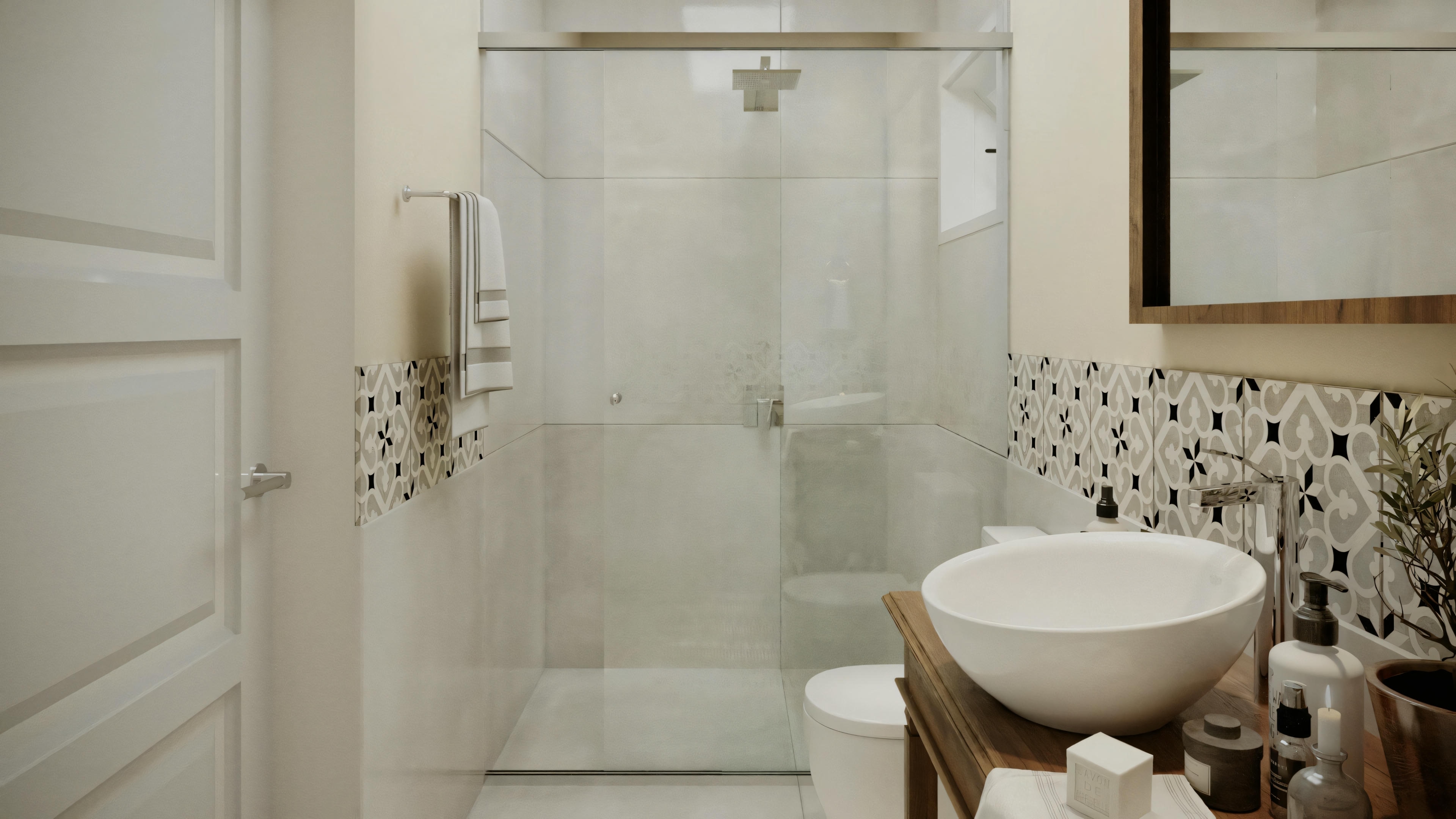 Baño con cabina de vidrio, lavabo blanco sobre encimera de madera y azulejos decorativos en la pared.
