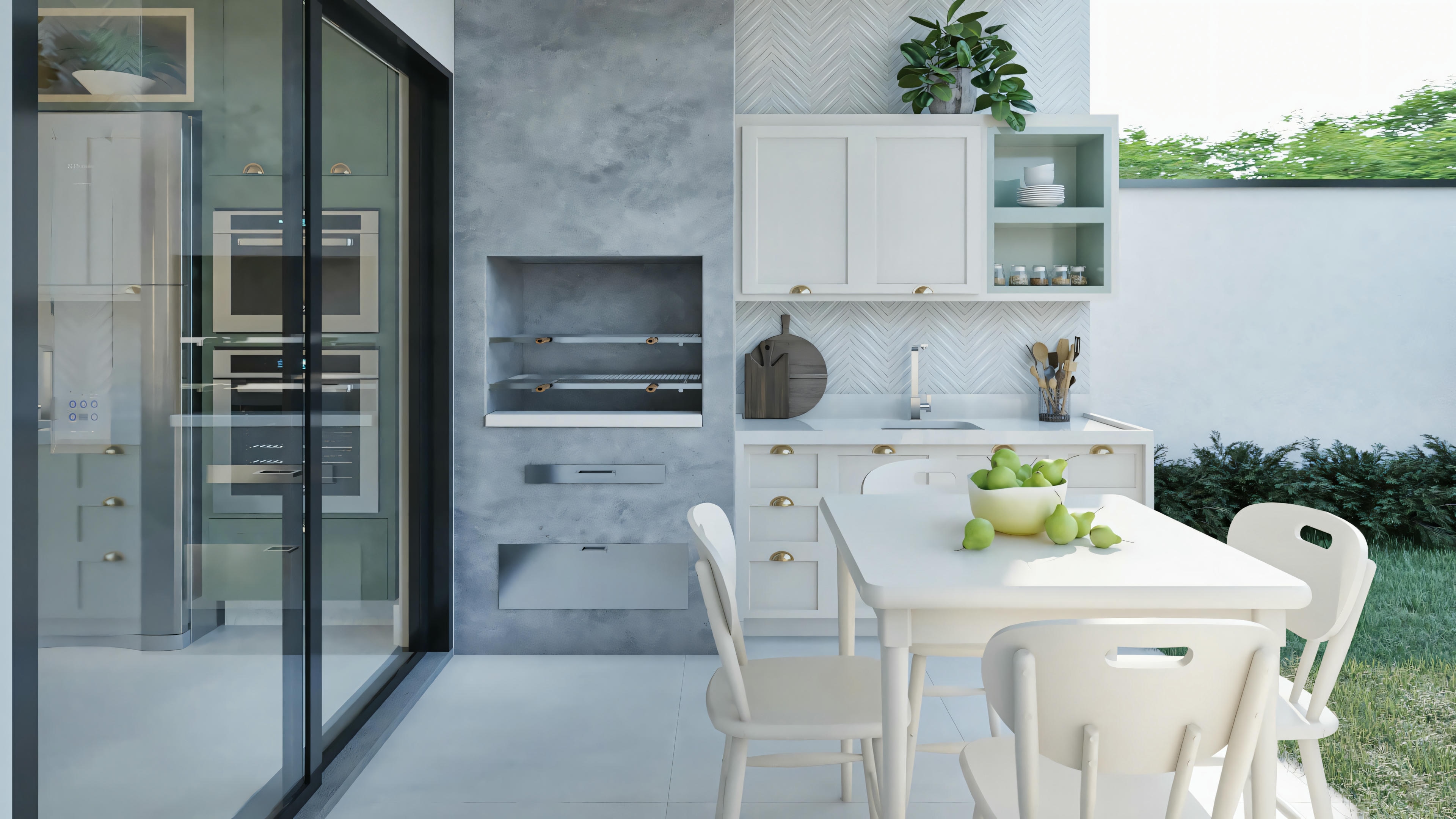 Cocina moderna con armarios blancos, electrodomésticos empotrados y una isla central. Hay una zona de comedor cerca de las puertas de cristal que probablemente dan al exterior, lo que sugiere una integración de los espacios interiores y exteriores.