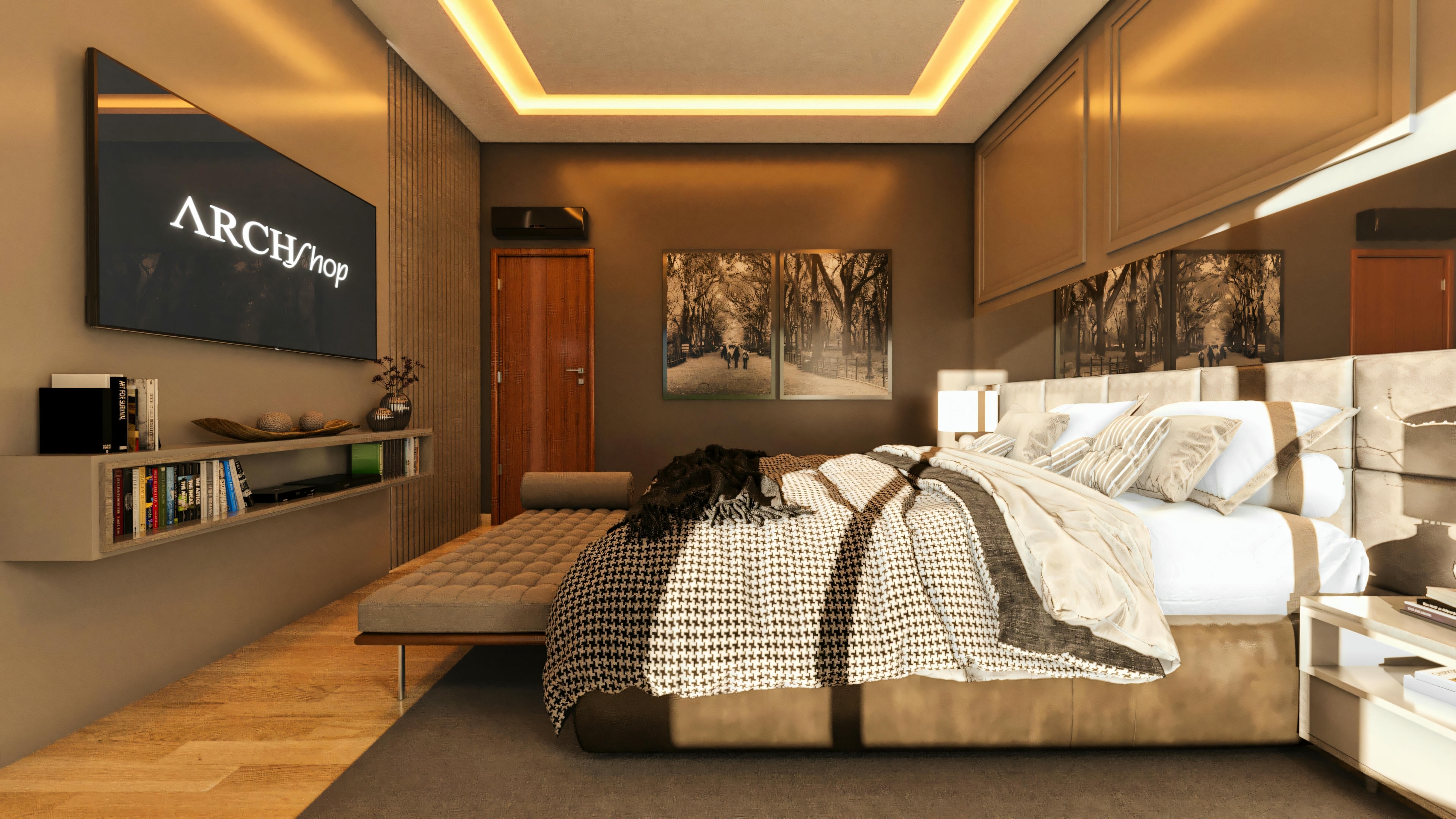 Suite de una casa de lujo con cama de matrimonio y cabecero tapizado, armarios superiores, espejo lateral reflejando el ambiente, panel con TV pantalla plana, estantería con libros, y banco tapizado a los pies de la cama. Falso techo de yeso con iluminación empotrada.