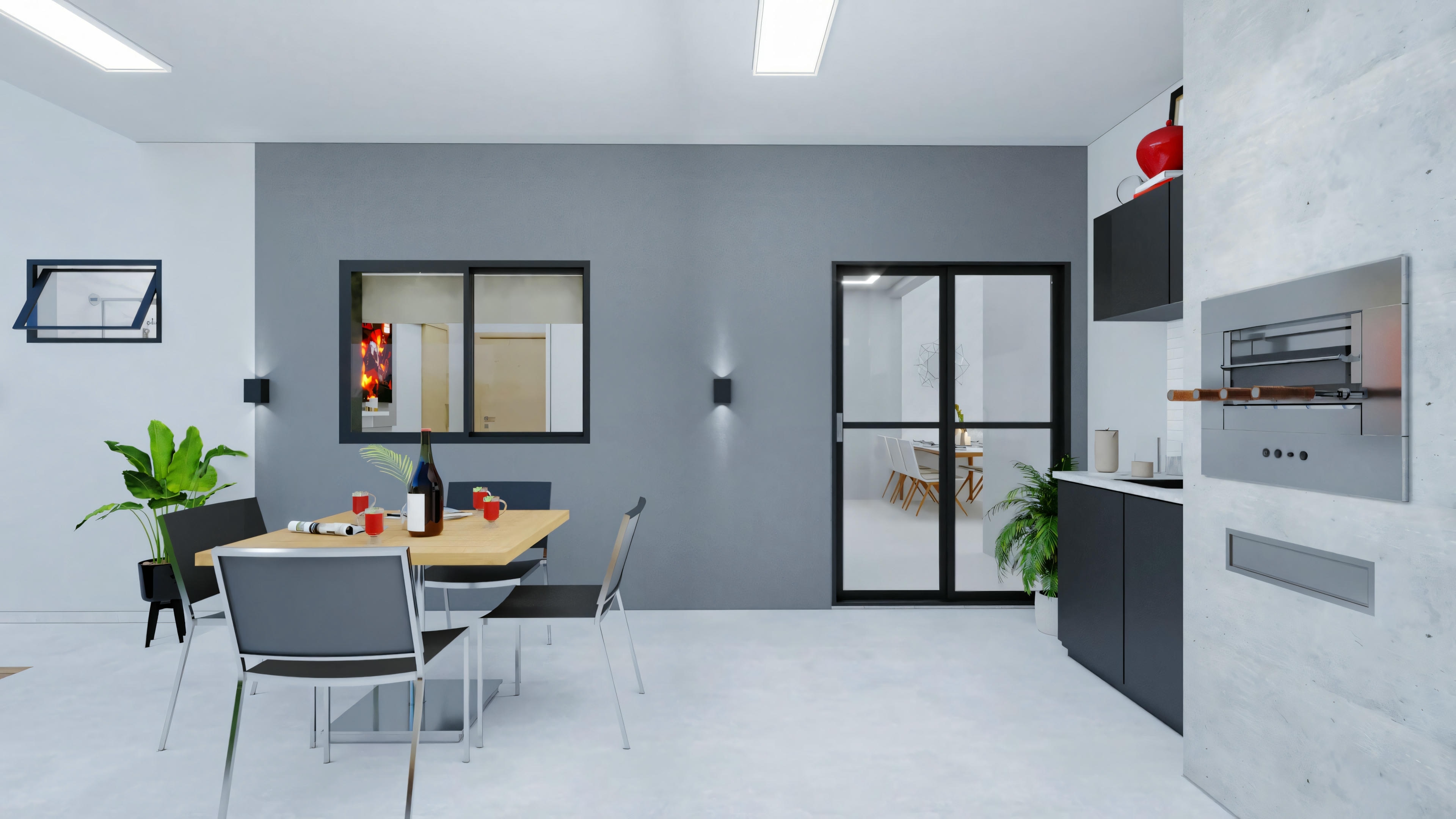 A gourmet area with white walls, a dining area with four chairs, and various kitchen appliances and utensils.