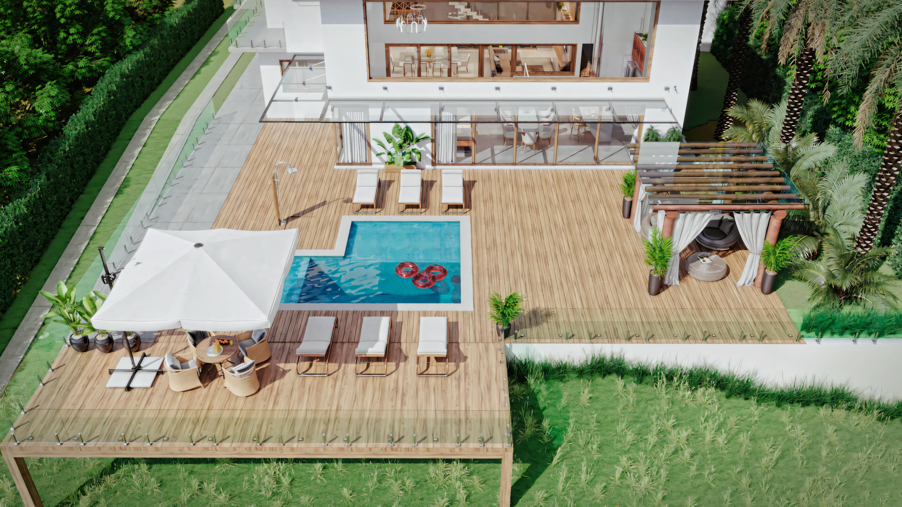 Aerial view of an outdoor residential area featuring a blue water pool with a heart-shaped design at the bottom, surrounded by a wooden deck.