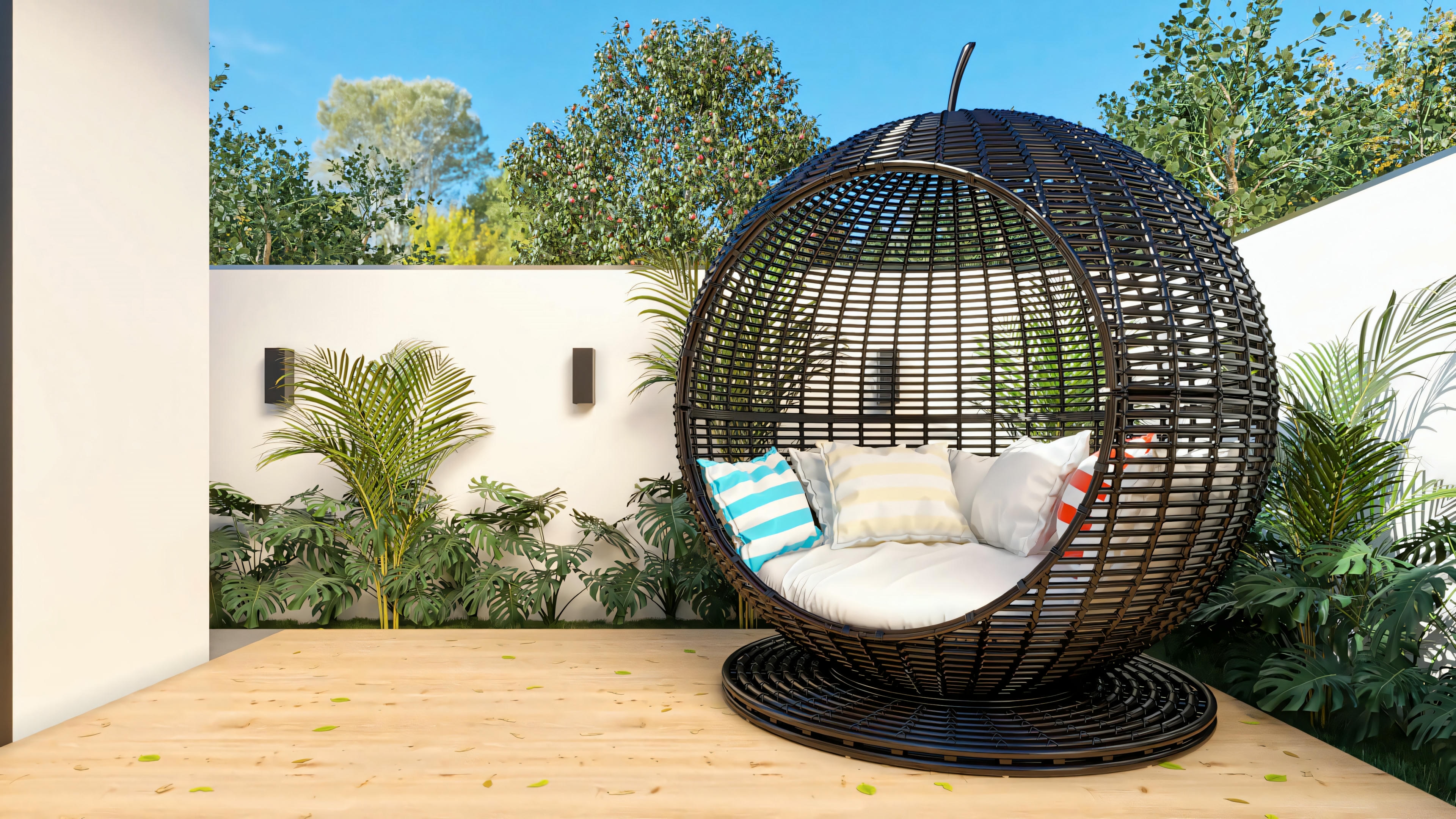 Detail of the outdoor area of the 3-bedroom ranch house, focusing on the black nest-type suspended armchair on the wooden deck, with landscaping and a white wall with sconces in the background.