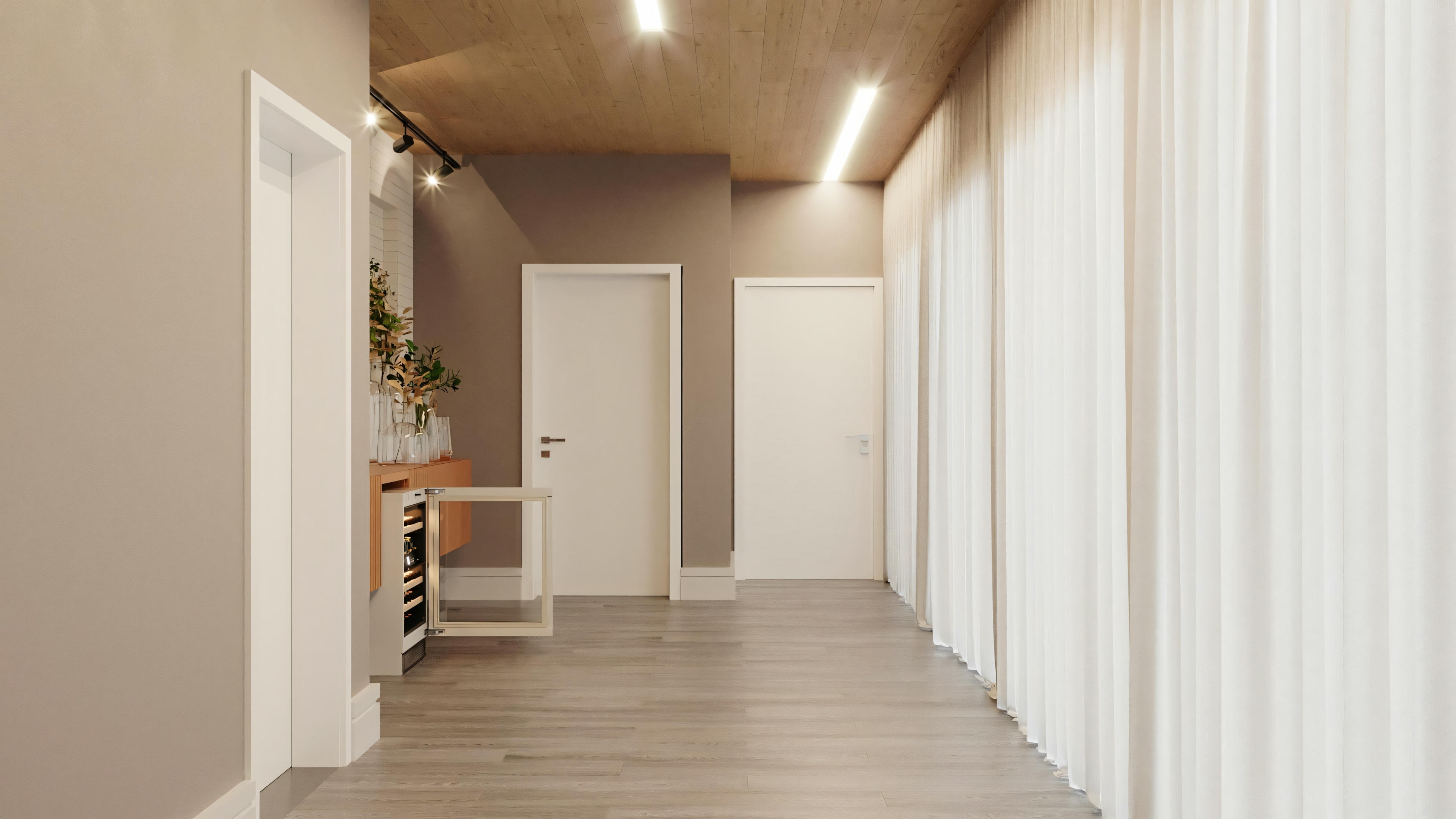Vista de um interior moderno, possivelmente uma sala de estar, com móveis elegantes e decoração contemporânea.