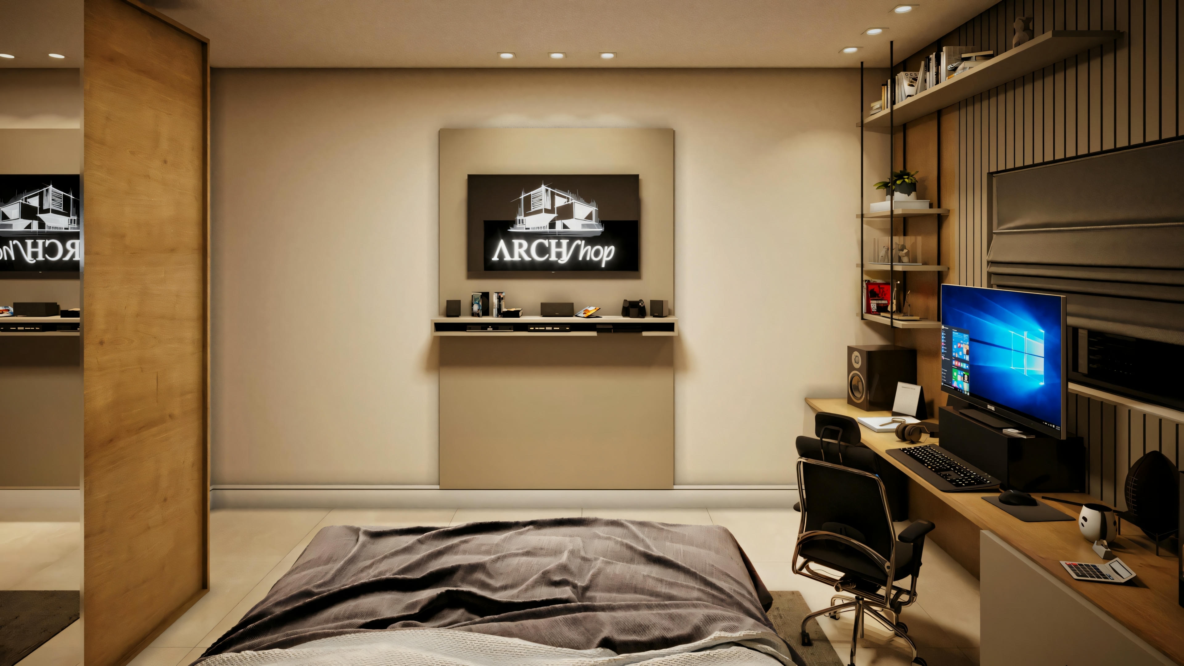Una habitación con una cama grande cubierta con colcha azul oscuro, televisión de pantalla plana montada en la pared y un escritorio con computadora.
