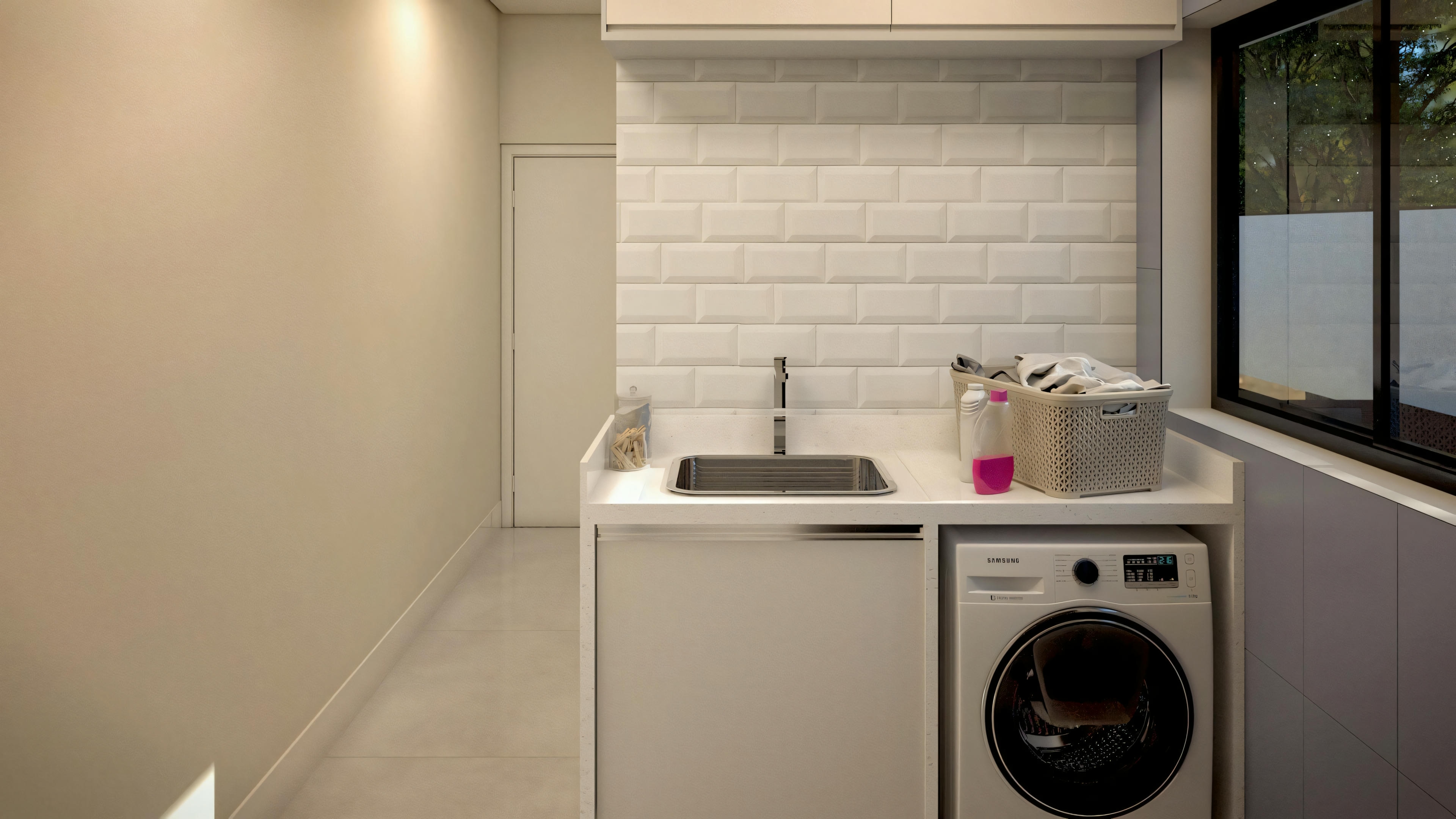 A laundry room with a washing machine, a white brick wall, and an ironing board leaning against the wall.