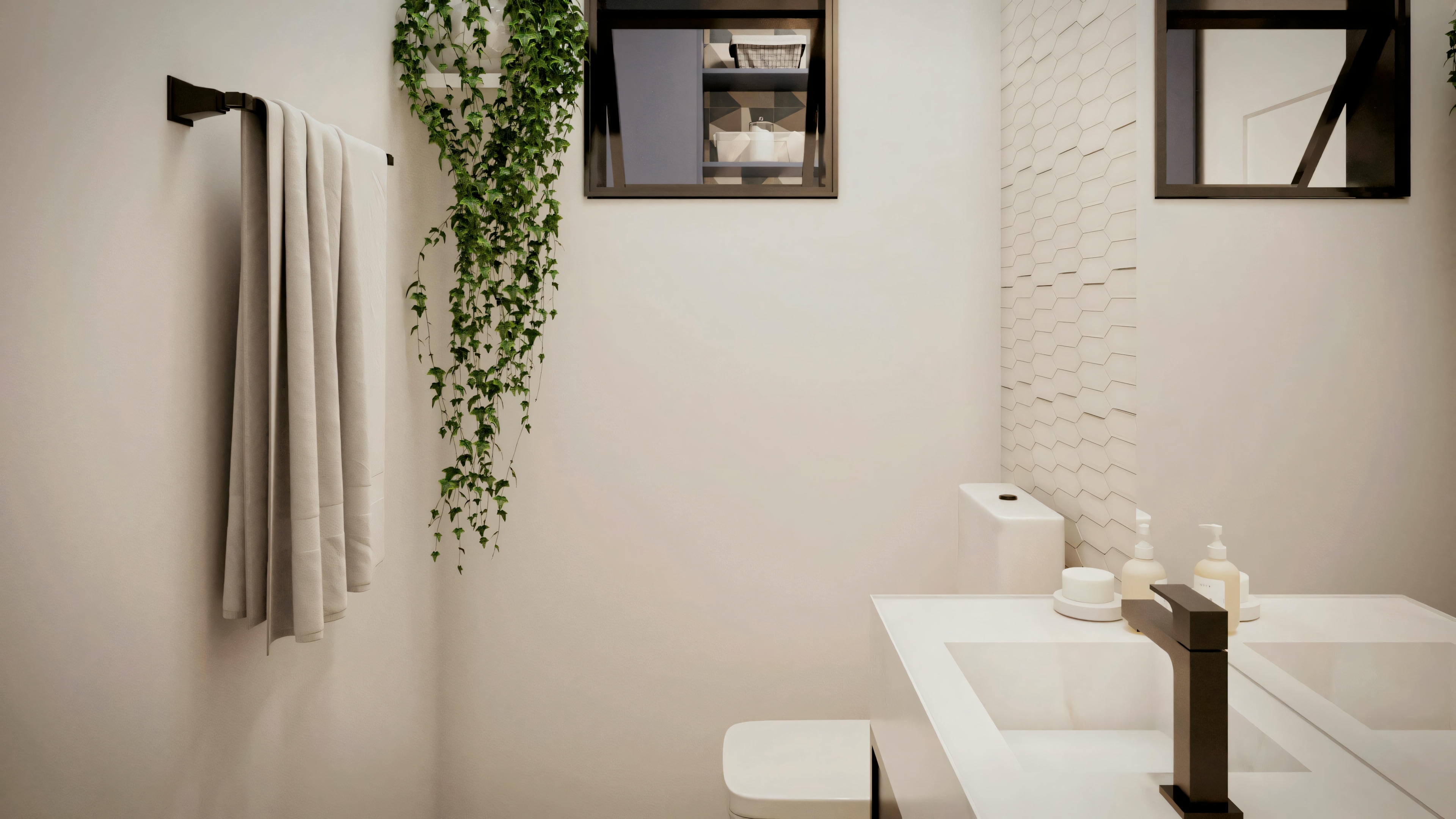 A modern bathroom with a white freestanding bathtub, a hanging plant, and light-colored walls with a framed picture.
