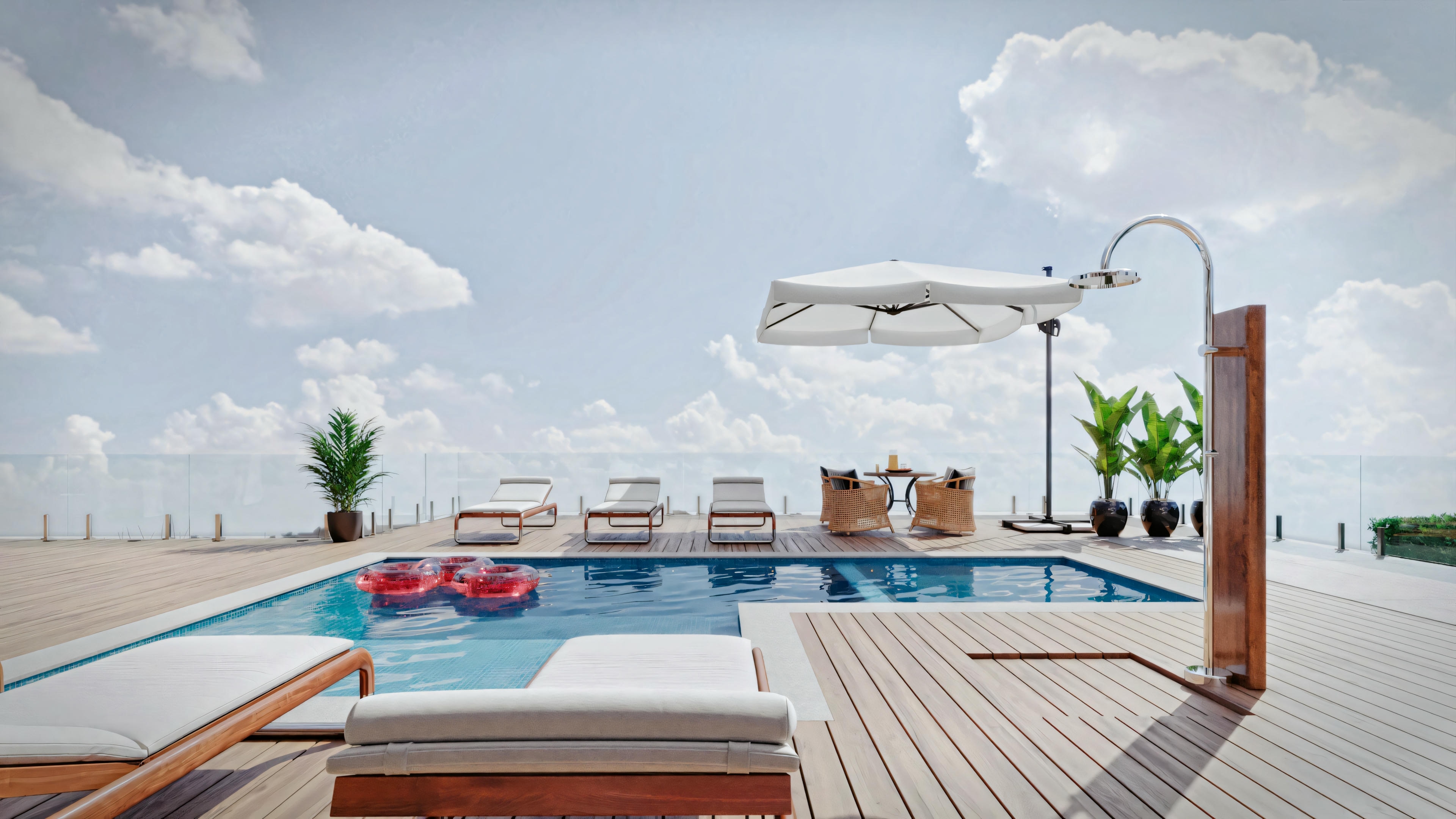 An outdoor pool area on a sunny day with clear skies. A drone is flying above the pool, and several lounge chairs are placed beside the pool.