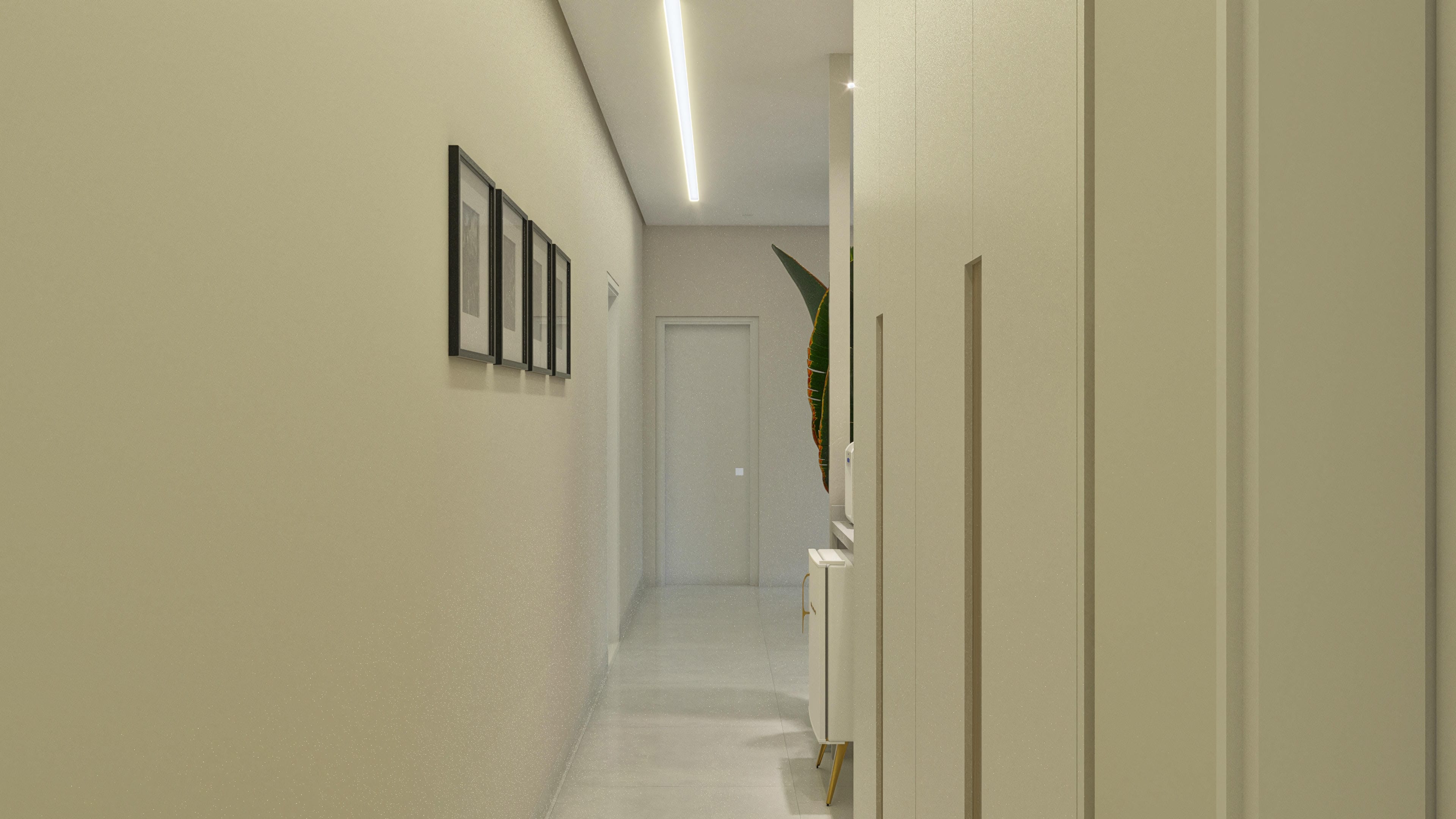 Interior de una casa de dos pisos con pasillo amplio, paredes en tono beige claro con textura sutil y cuadros decorativos alineados. Iluminación lineal empotrada en el techo.
