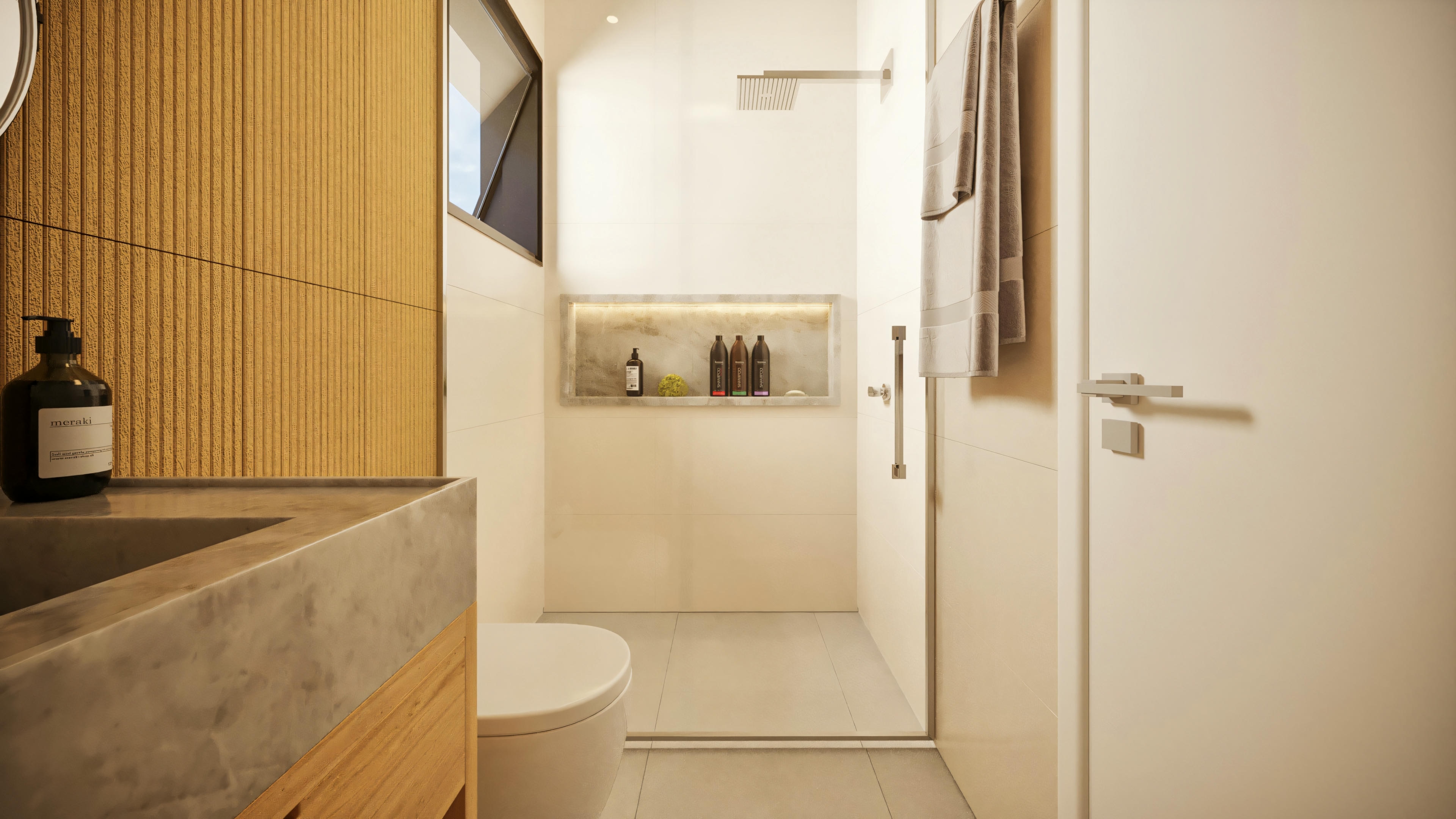 Baño de suite con box de vidrio, nicho empotrado, ducha moderna, inodoro, encimera de piedra con lavabo y pared con revestimiento amarillo texturizado.