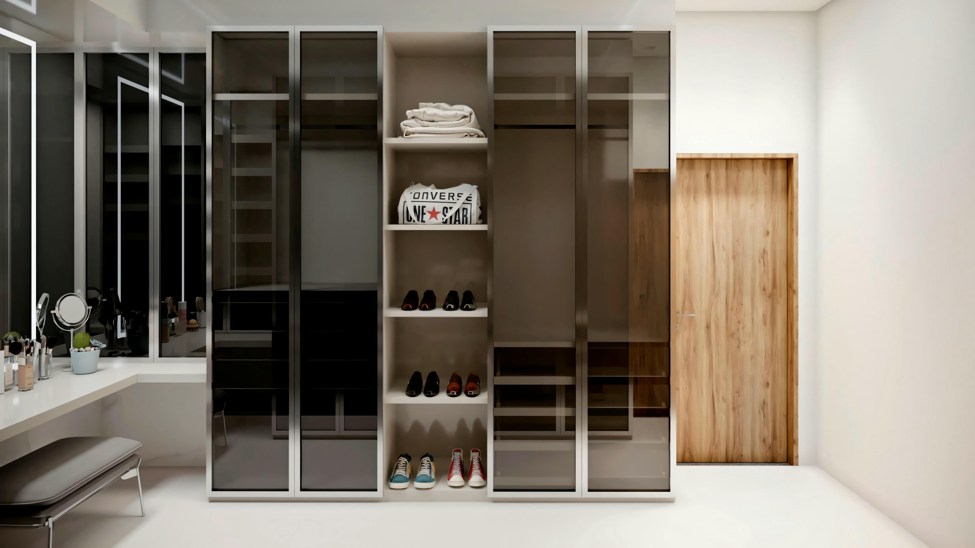Um closet com prateleiras abertas, seções para pendurar roupas e gavetas em um esquema de cores mais escuro com iluminação de destaque.