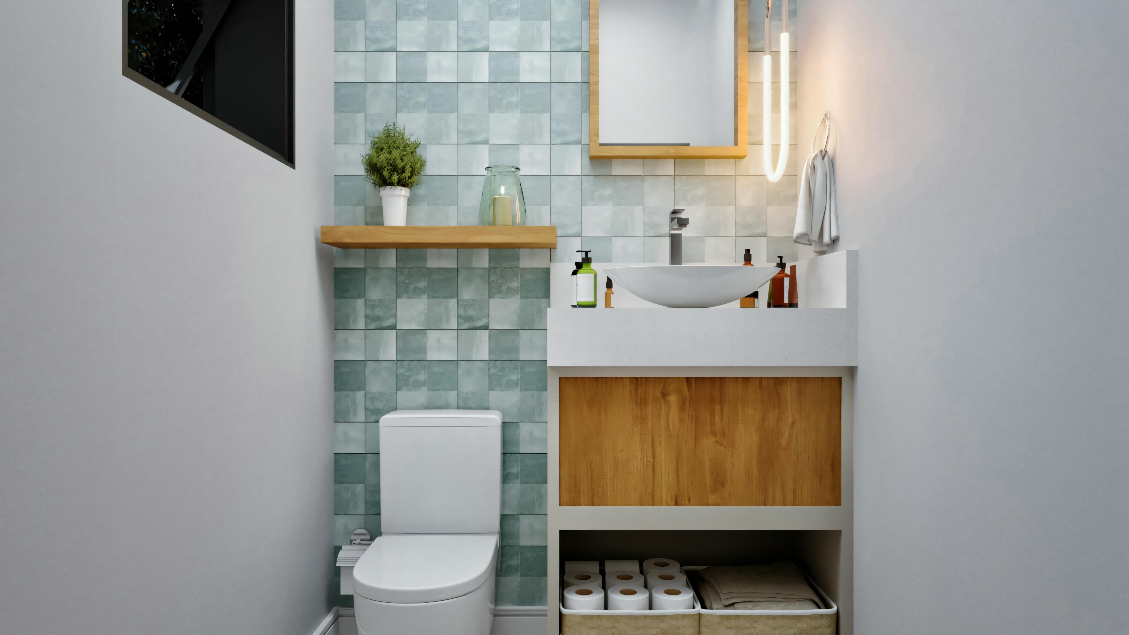 Small bathroom with white walls and a section of teal tiles, a white toilet next to a sink with a wooden cabinet, and a mirror above.