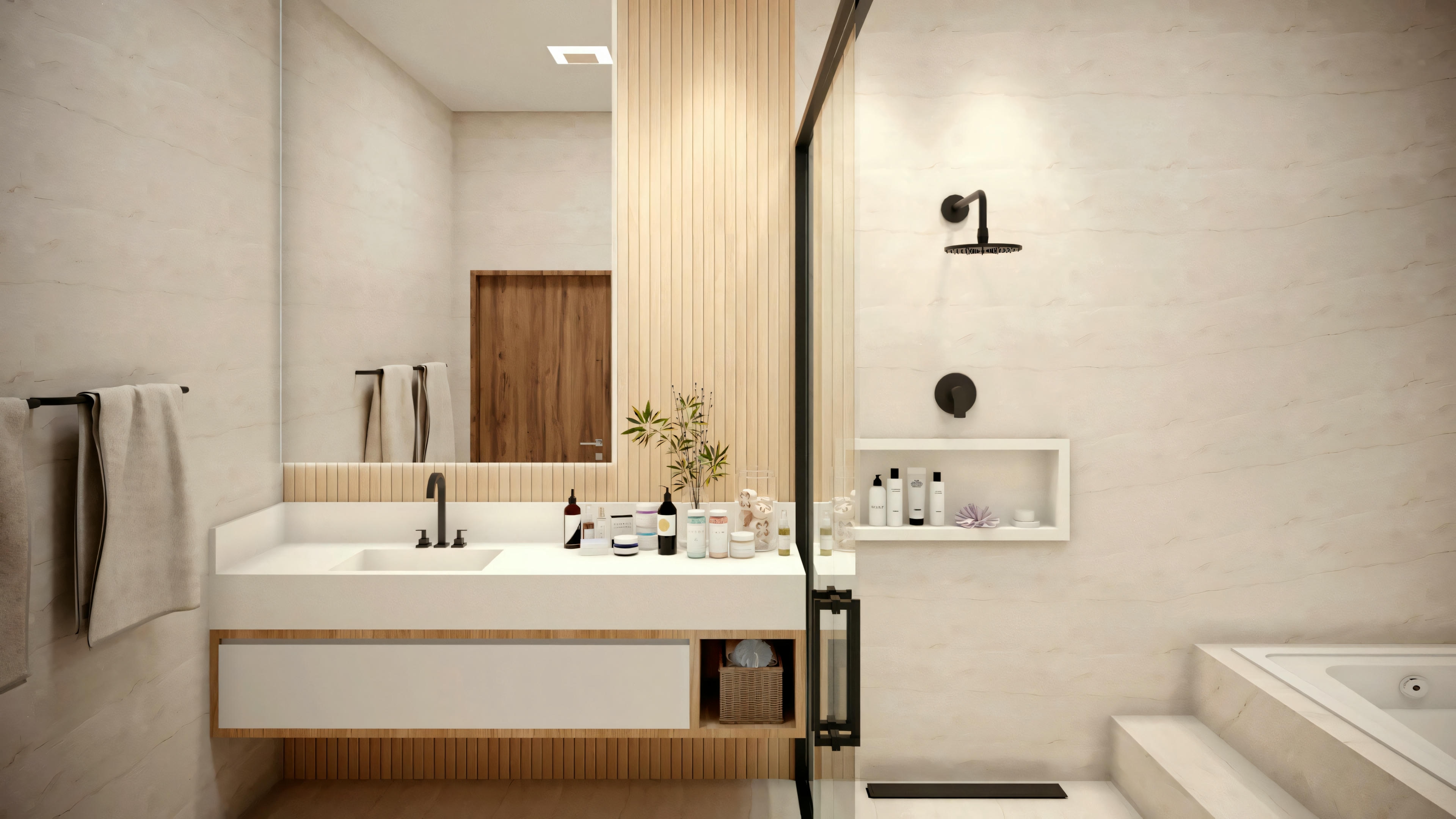 Un baño moderno con espejo grande, lavabo y detalles en mármol.