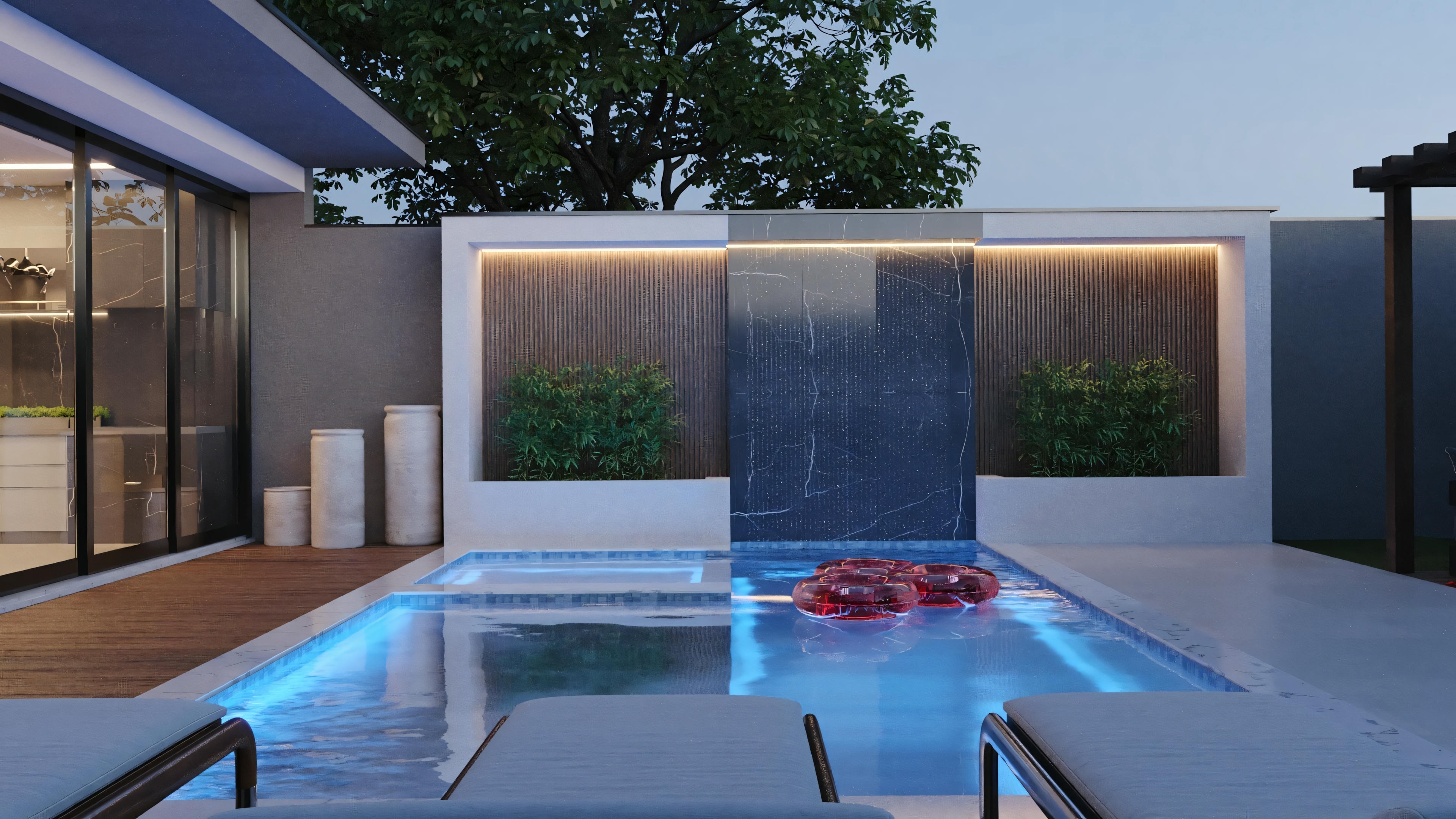 An outdoor area with a blue-lit pool and floating red flowers, surrounded by a patio and a building with illuminated windows.