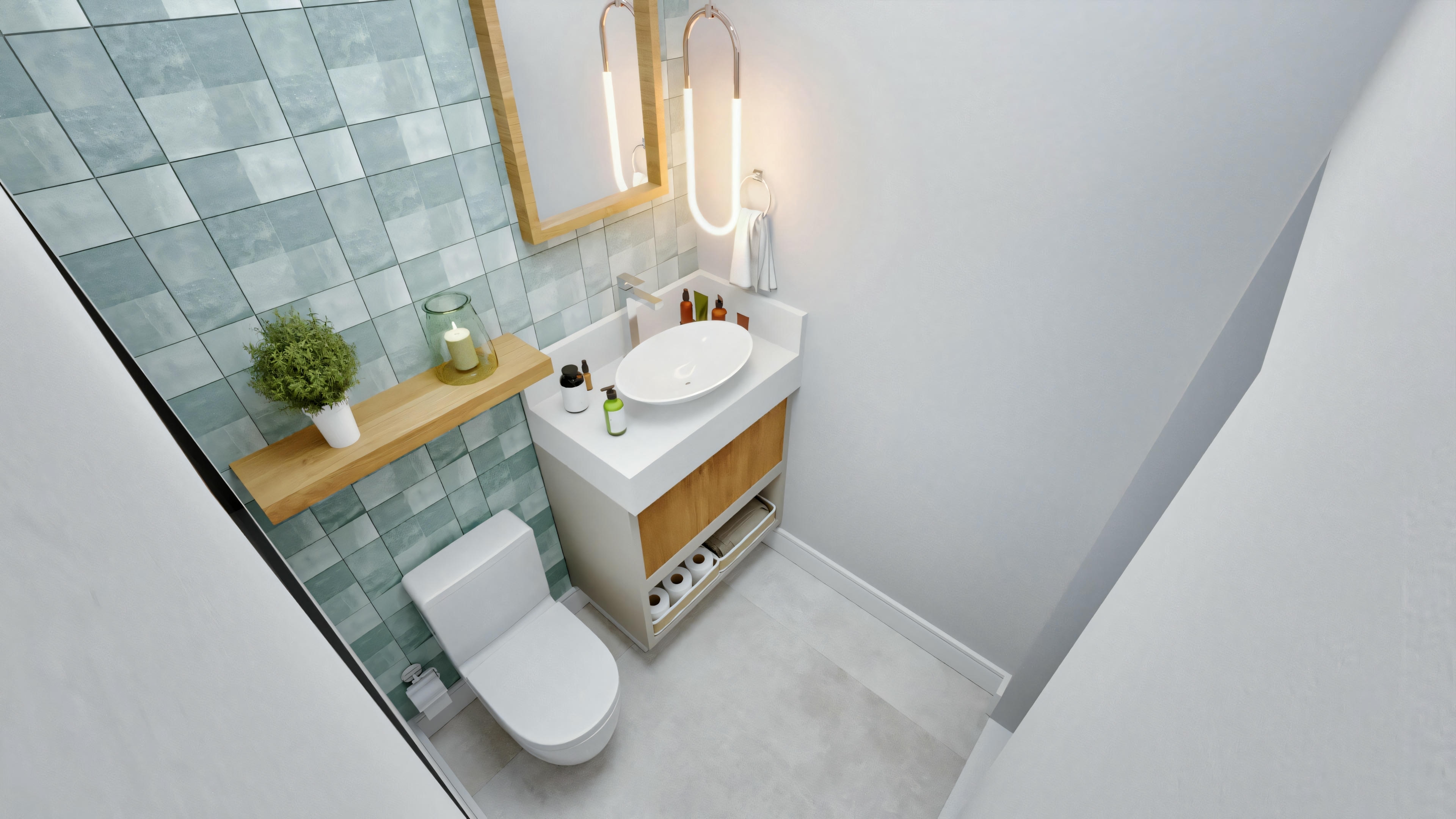 A small bathroom with a corner sink, toilet, and blue patterned wall tiles.