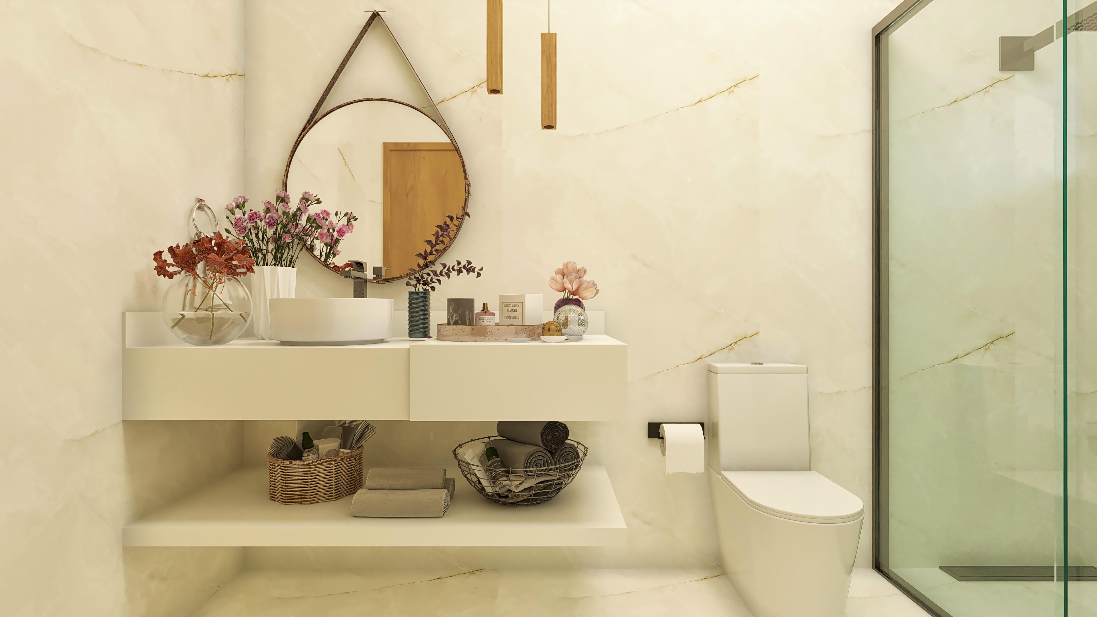 Baño con revestimiento de mármol claro, encimera con lavabo esculpido, espejo redondo y cabina de vidrio con acabado oscuro.