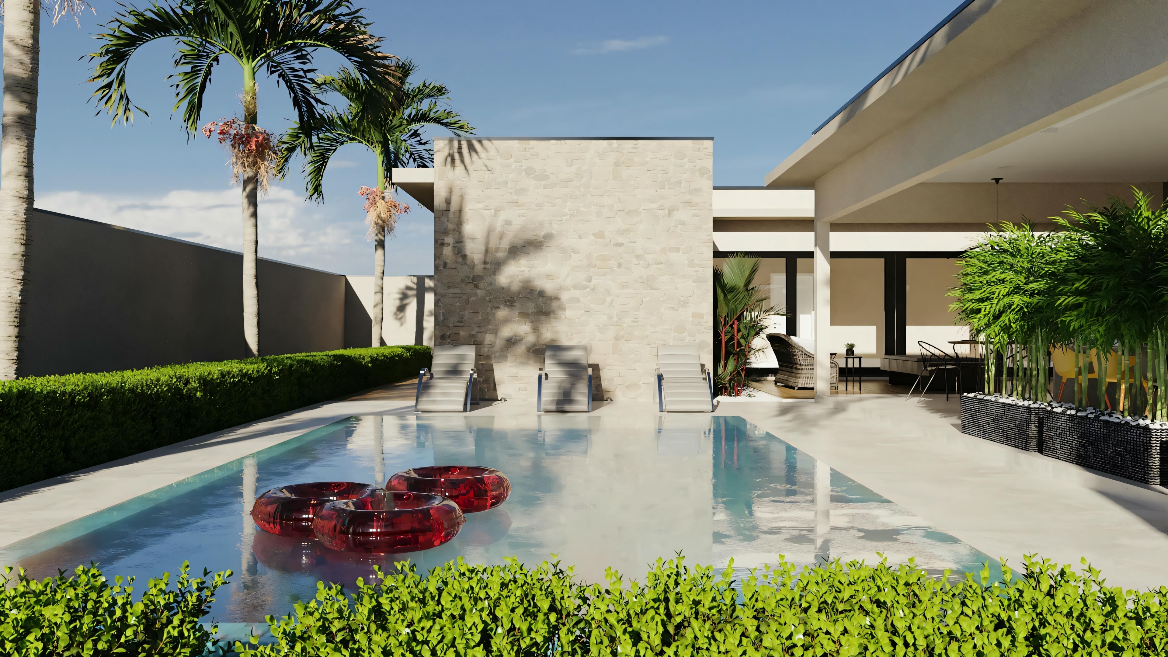Otra vista exterior de una casa moderna con piscina, incluyendo plantas con flores rojas cerca de la zona de la piscina, añadiendo color a la escena.
