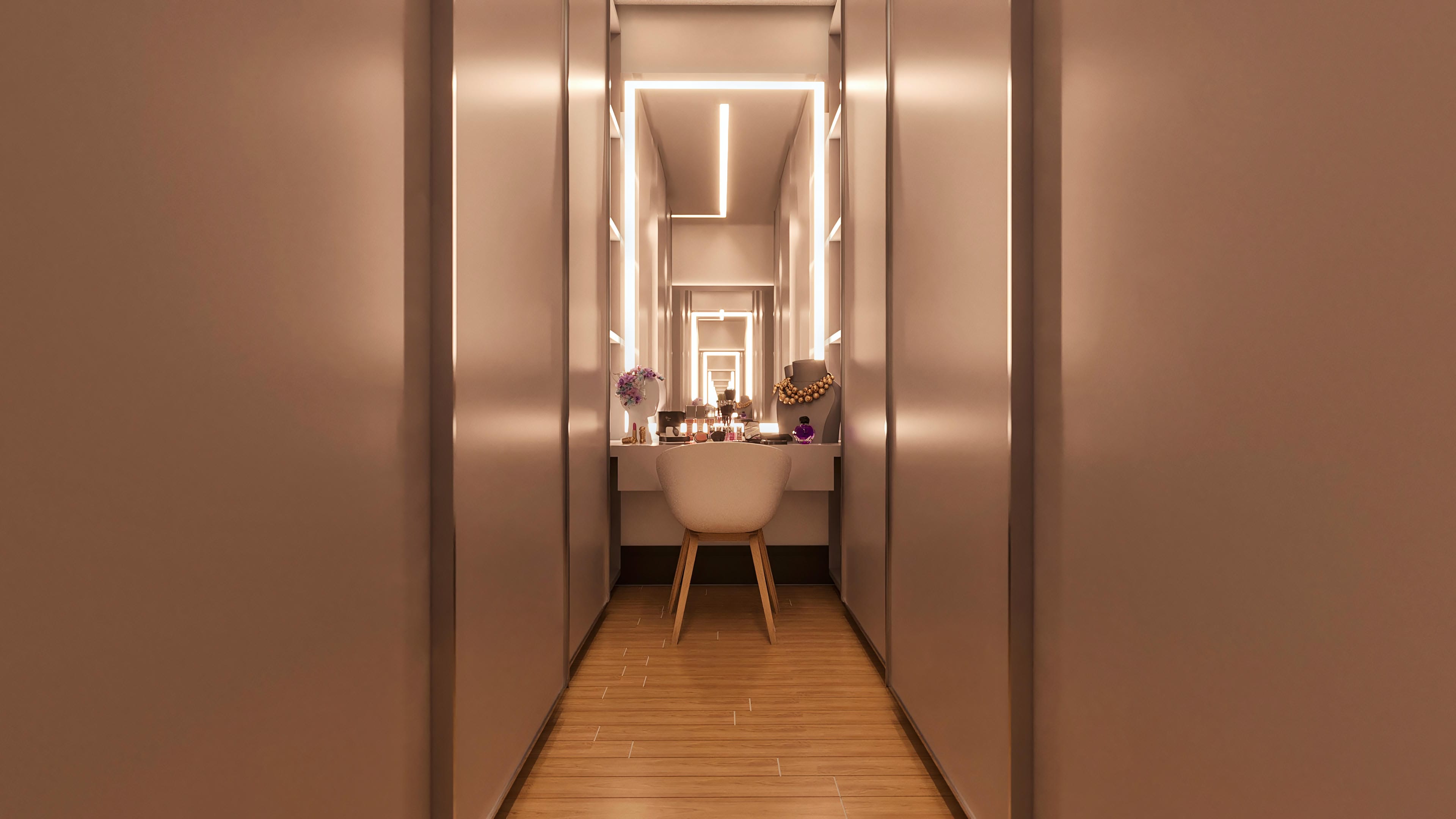 View of a modern closet with built-in lighting, mirrors, and custom furniture in neutral tones, featuring a vanity.