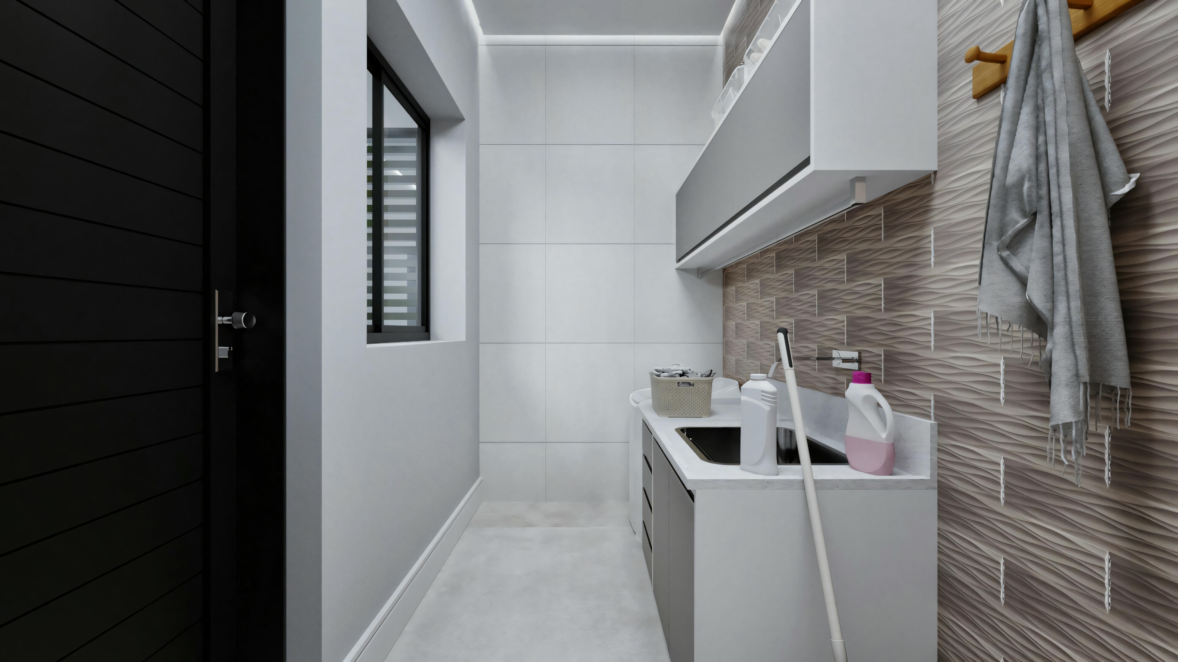 A modern laundry room with a washing machine and sink. There are cabinets above and below the sink area, and to the right, there appears to be a tall storage unit.