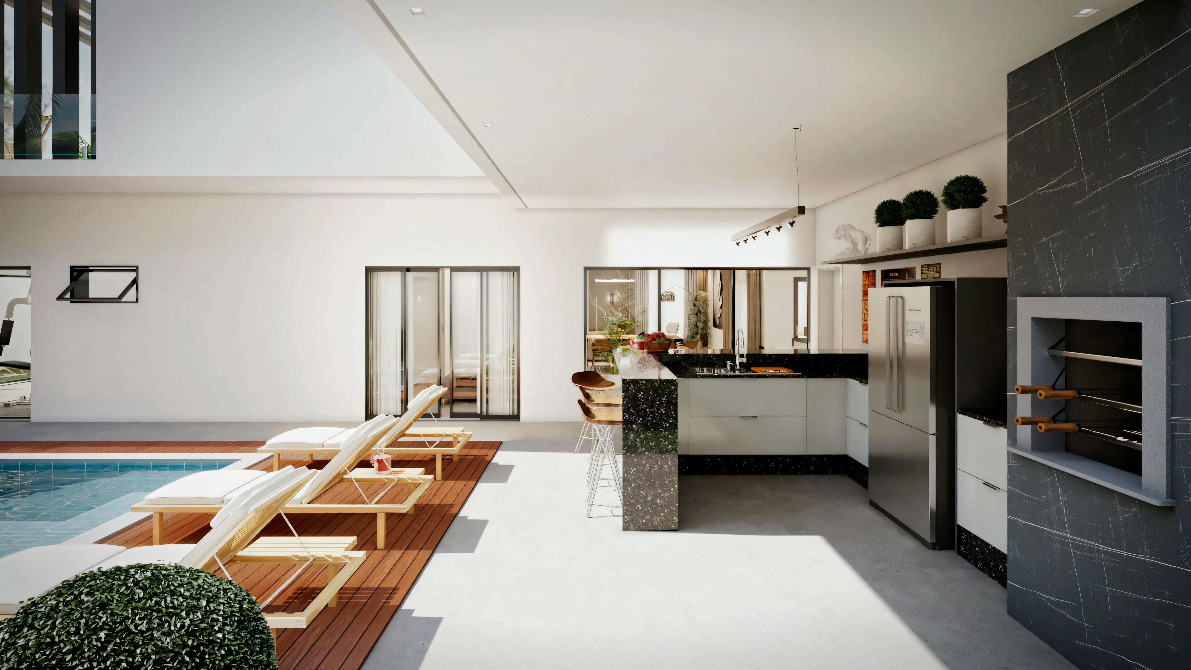 Uma sala de estar espaçosa com cozinha aberta ao fundo, móveis contemporâneos, piso de madeira e grandes portas de vidro que levam a uma área externa com espreguiçadeiras ao lado de uma piscina.