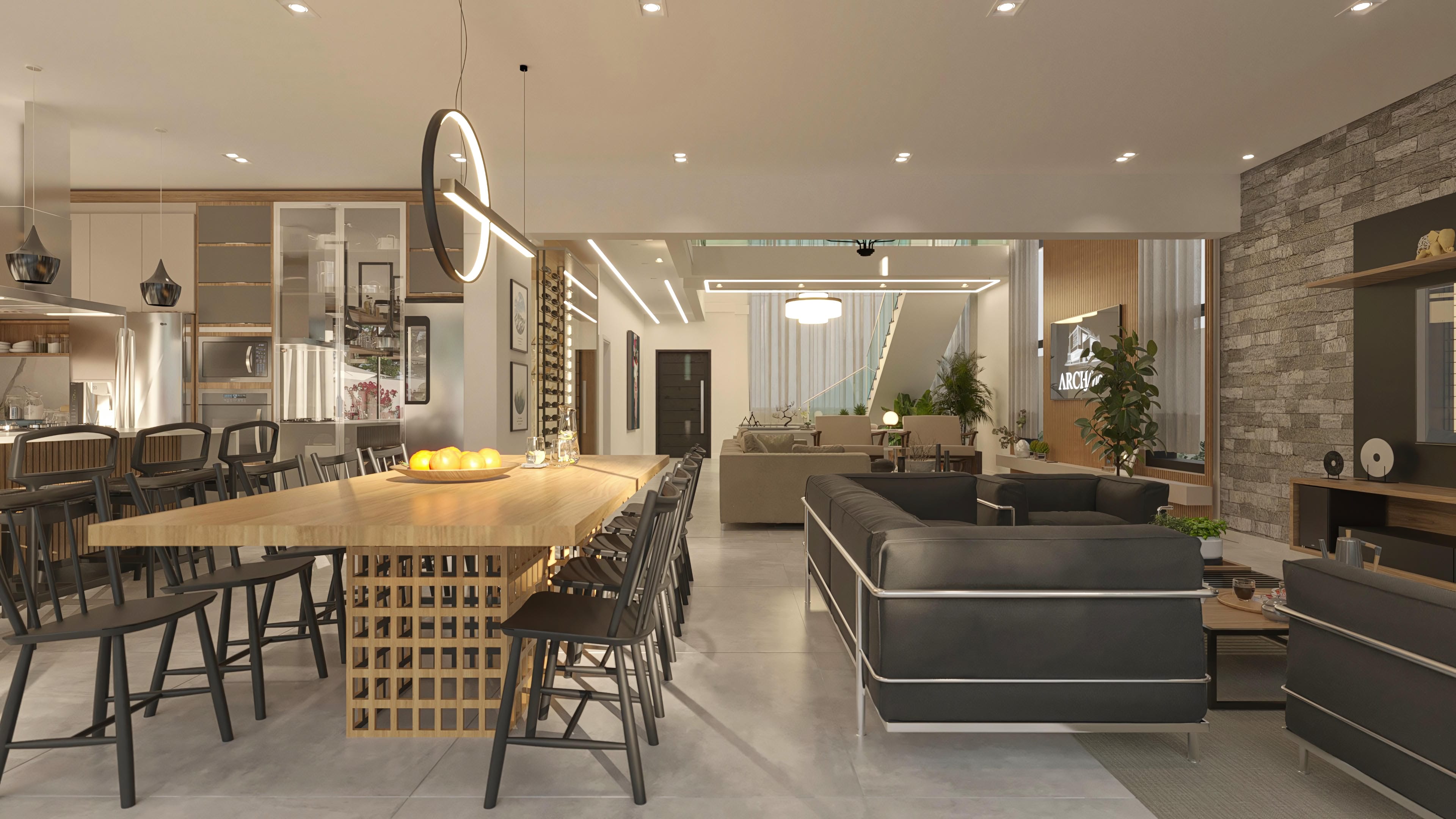 Interior de sobrado moderno com conceito aberto, destacando a ampla sala de jantar com mesa de madeira e cadeiras pretas, cozinha integrada e sala de estar com sofá escuro.