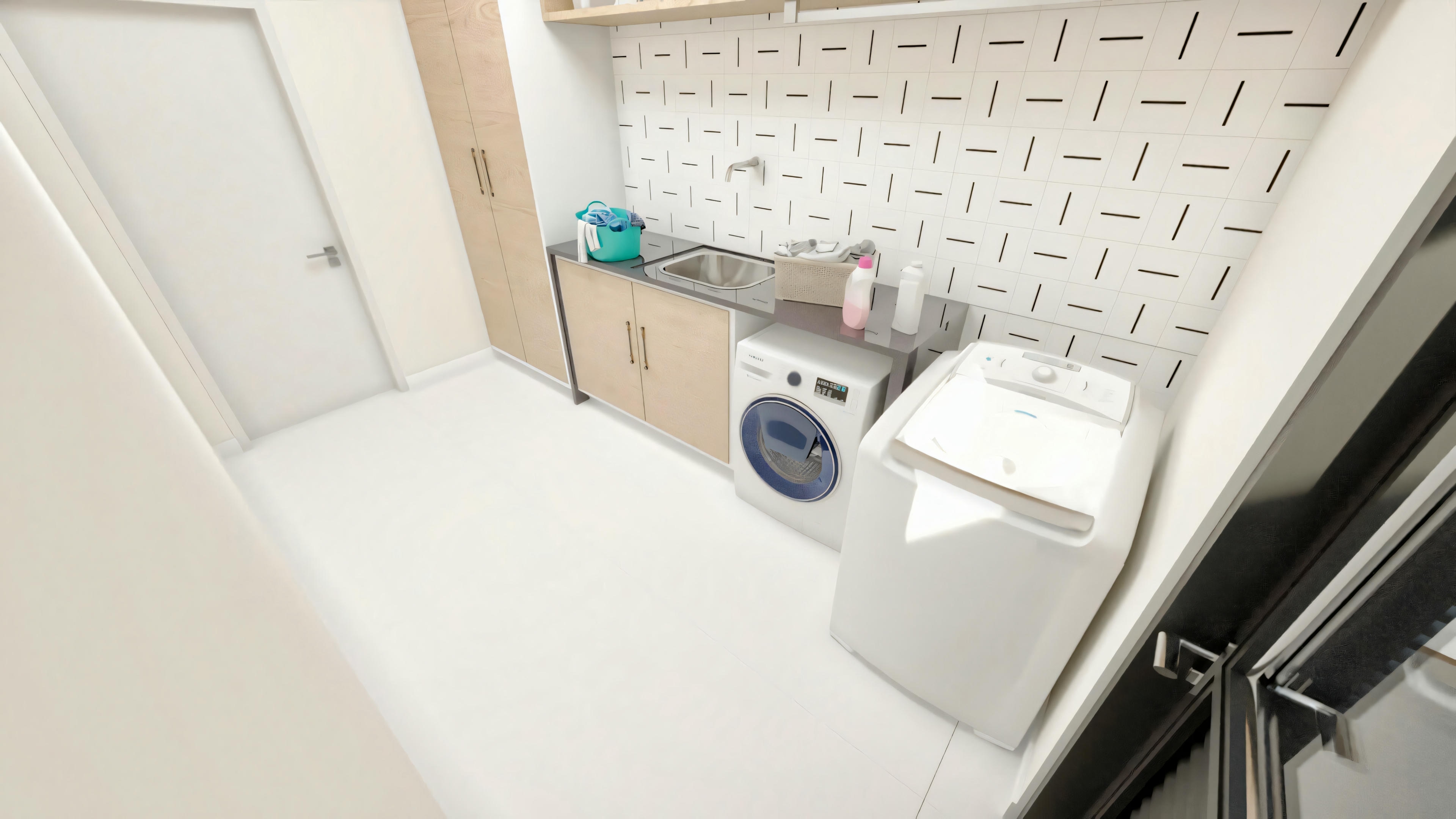 Complete laundry room of a ready-made project with 5 suites, equipped with a built-in stainless steel sink in the countertop, front-loading washing machine, light wood planned cabinets, and access door.