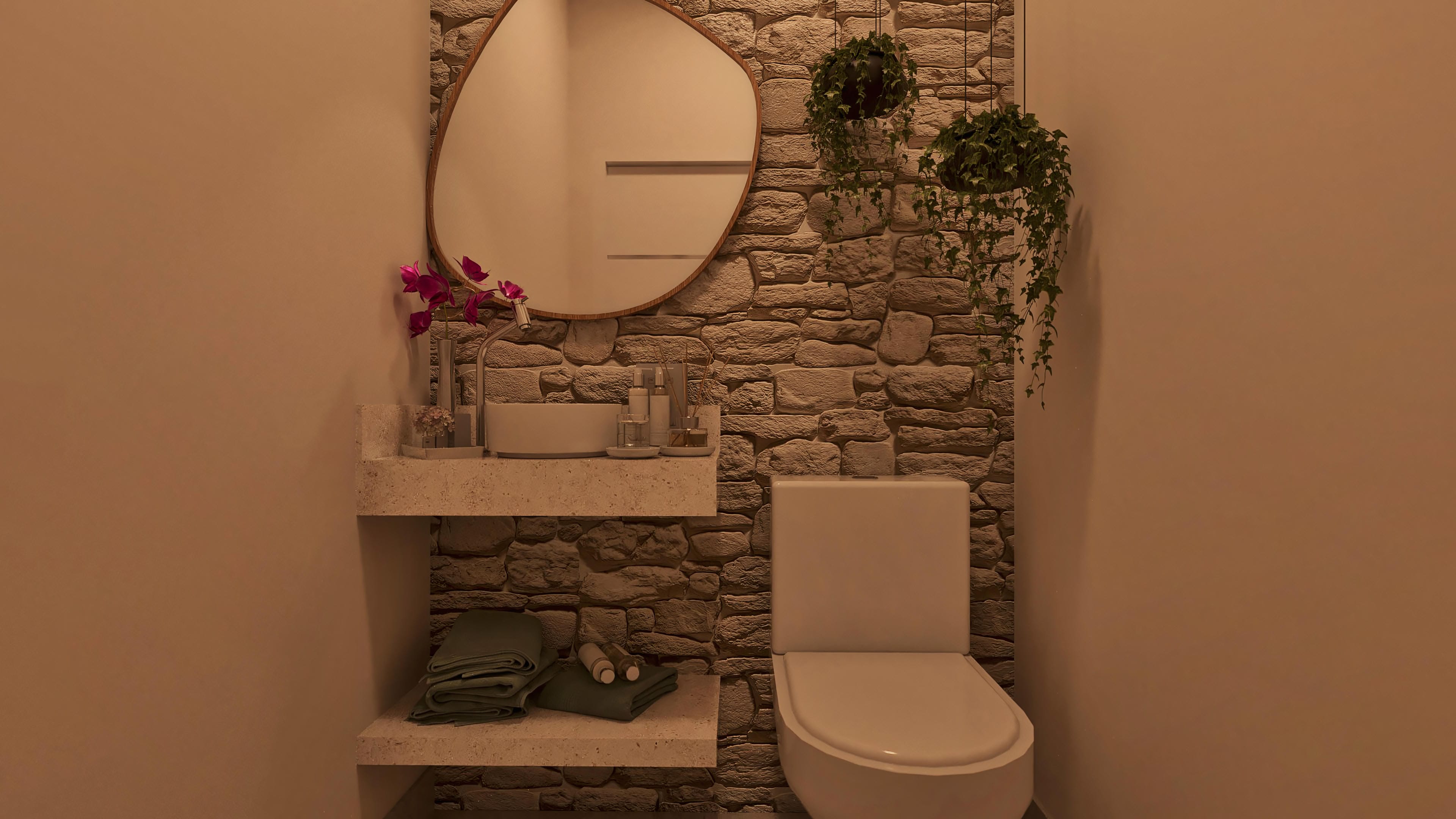 Cuarto de baño moderno con detalle en piedra natural en las paredes, encimera en piedra con lavabo esculpido y espejo ovalado con marco de madera.