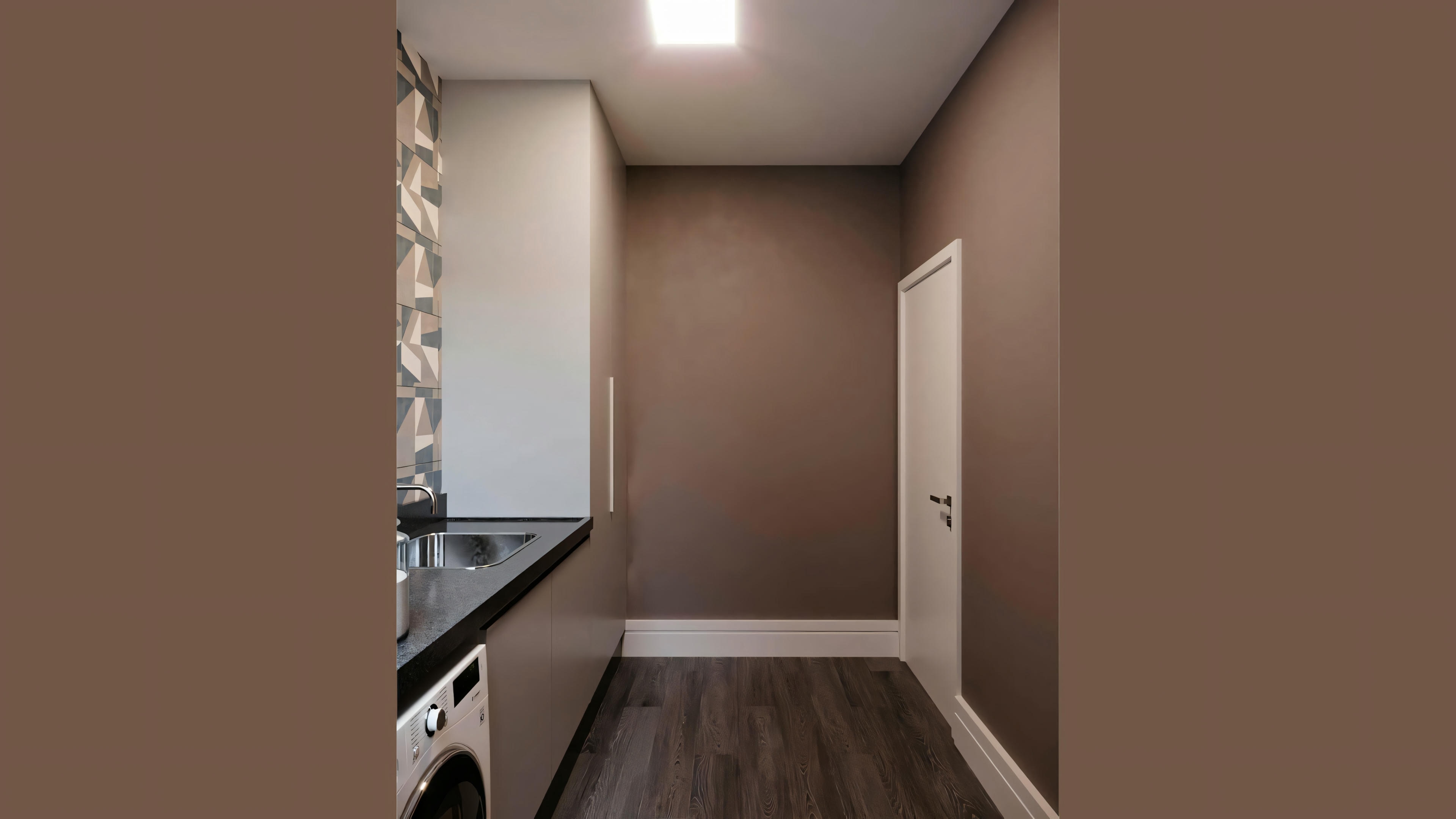 An interior space, possibly a hallway or small room, with a wood floor and light brown painted walls.