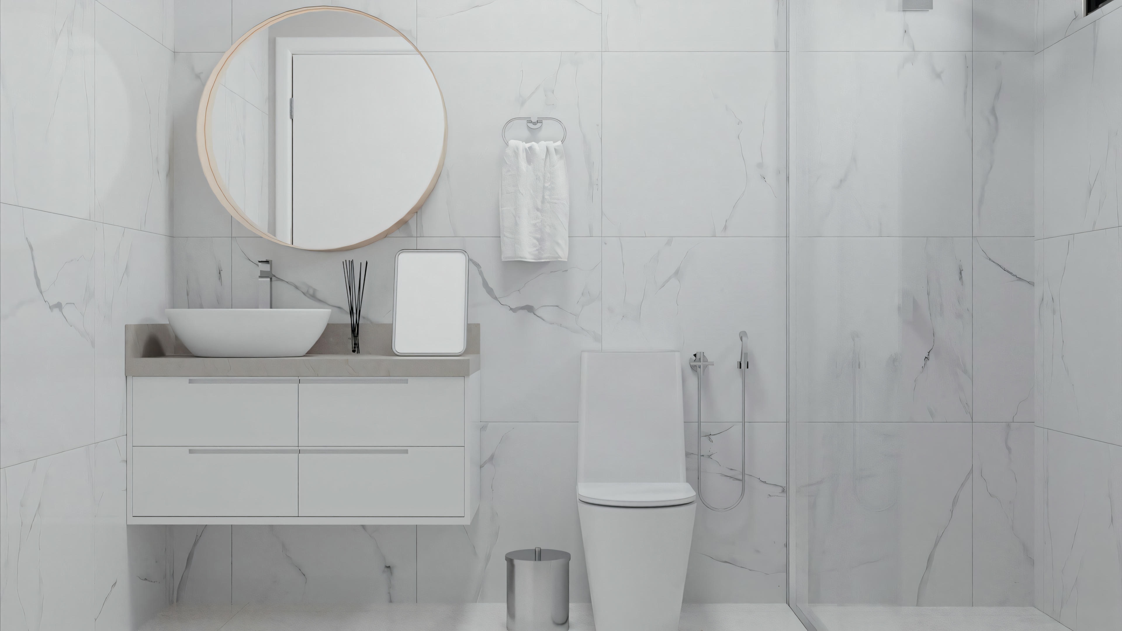 A bathroom with a shower area visible through glass doors.