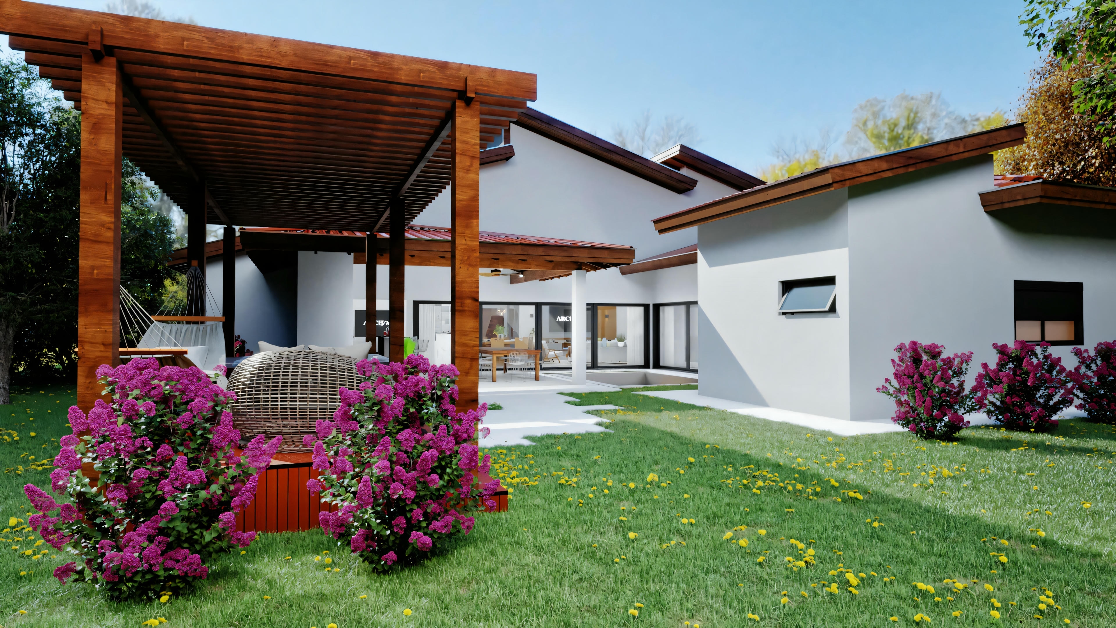 Espaço de jardim exterior com plantas floridas e caminho que leva a um edifício.