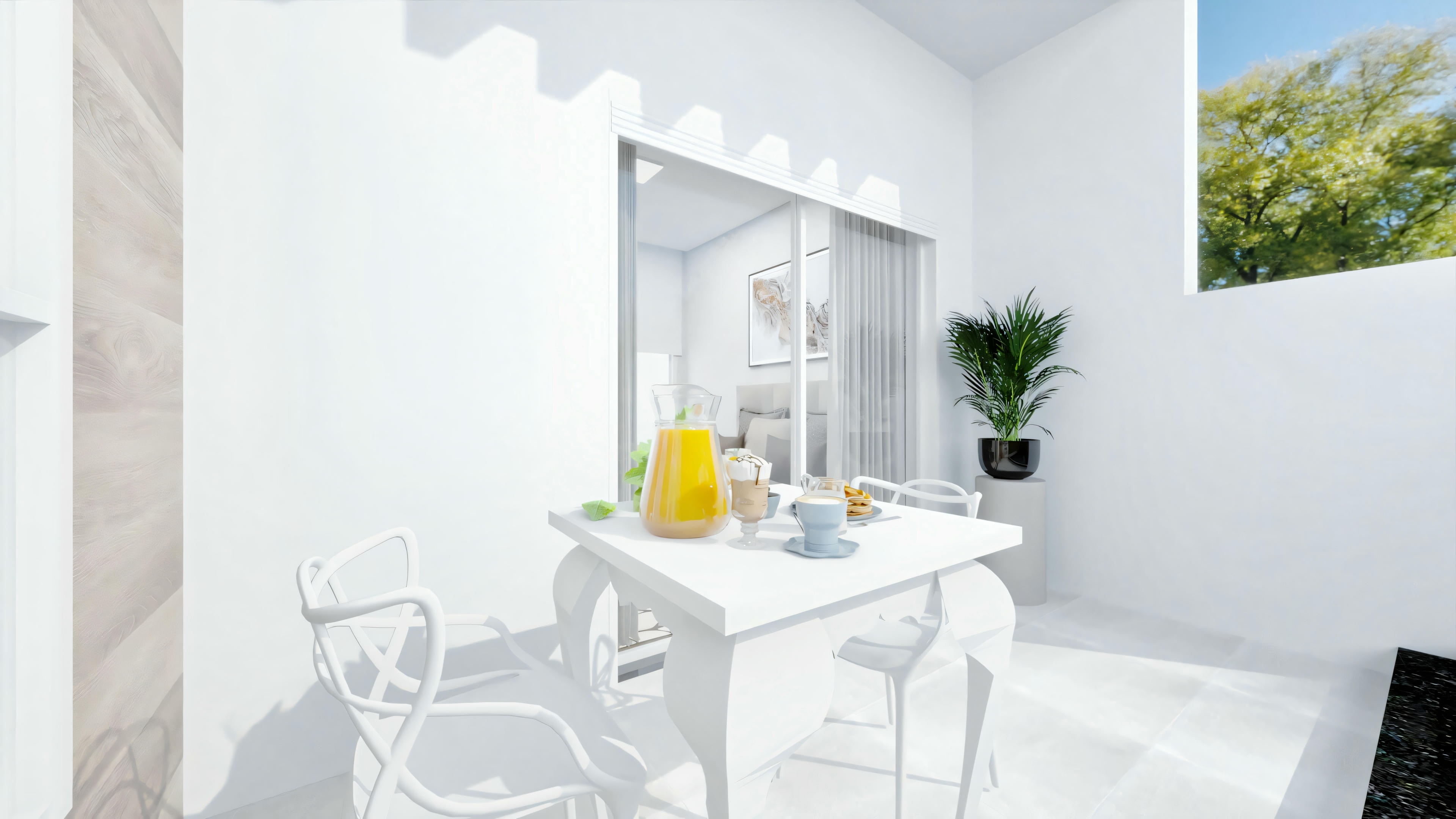 An outdoor area with white walls, a table with two chairs, and a yellow decorative item on the table. There is greenery in the background.