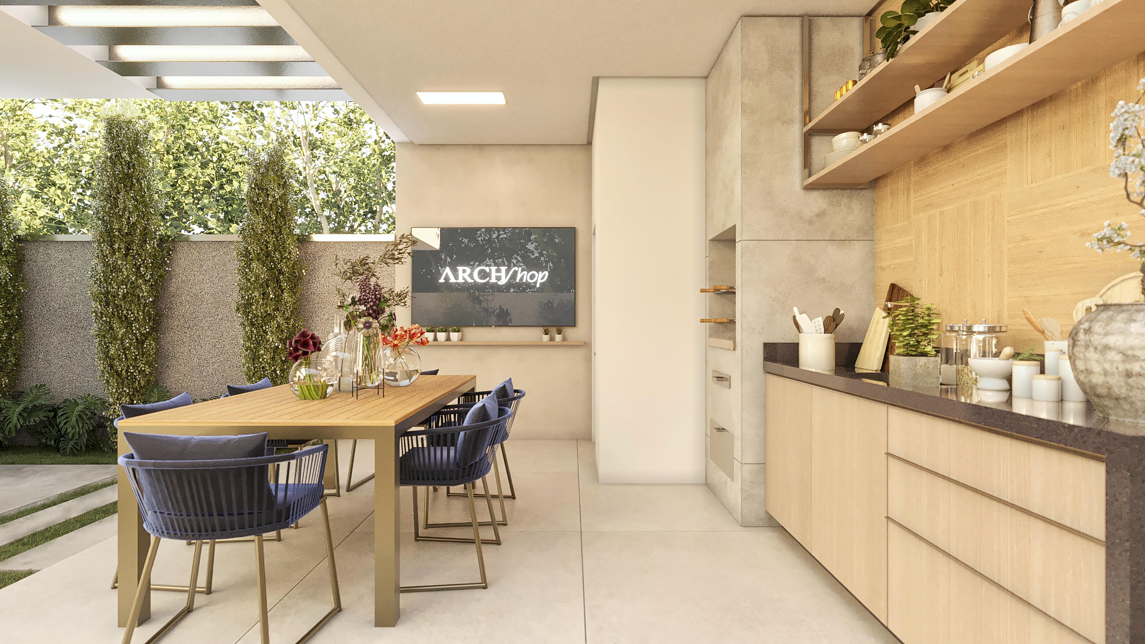 Área gourmet externa con barbacoa moderna, encimera de granito, armarios planificados en madera clara, mesa de comedor y sillas azules. Integrada a un espacio de ocio con paisajismo exuberante.