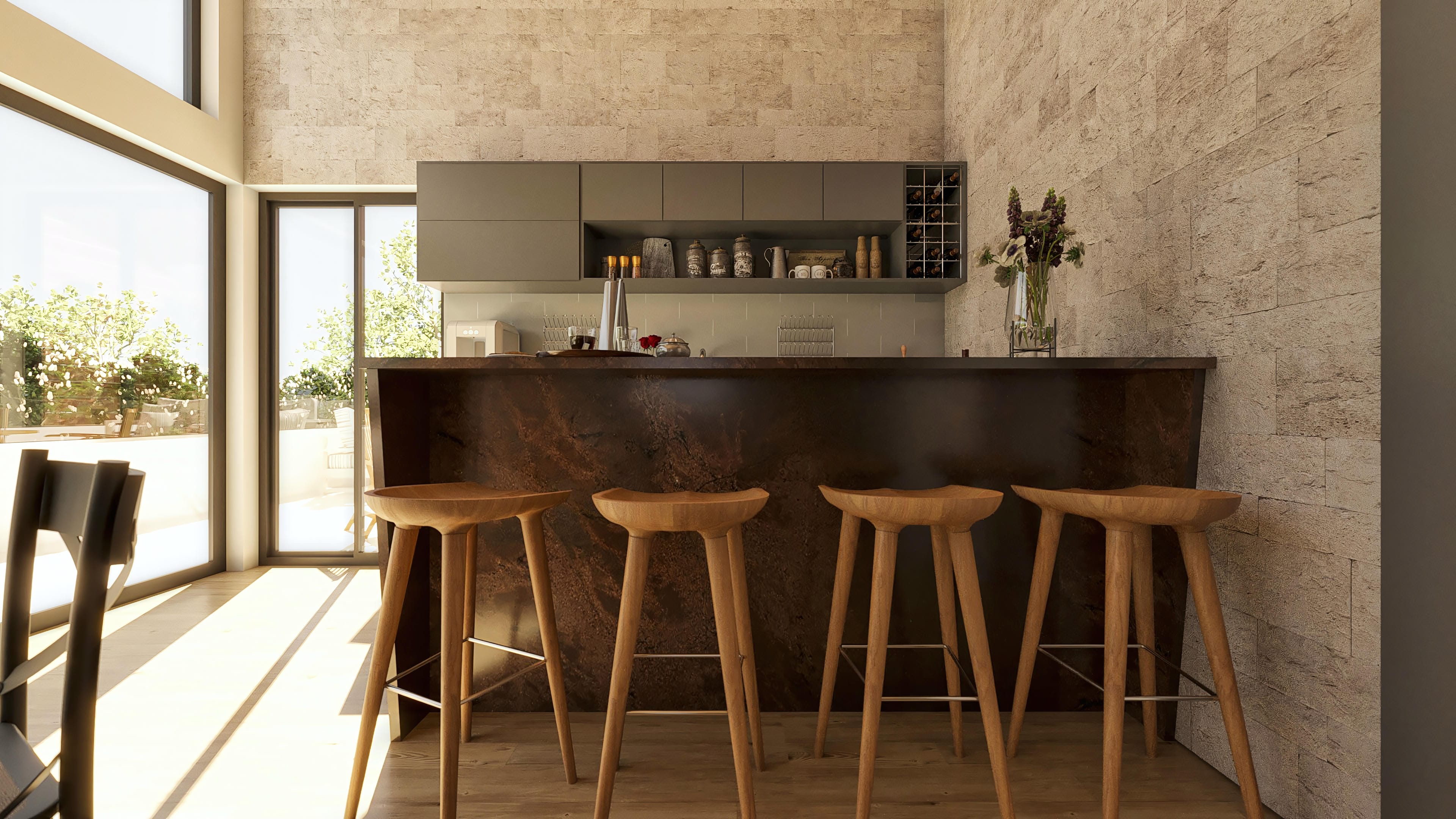 Interior moderno con paredes revestidas en piedra natural texturizada, encimera de cocina con acabado en mármol oscuro y taburetes de madera.