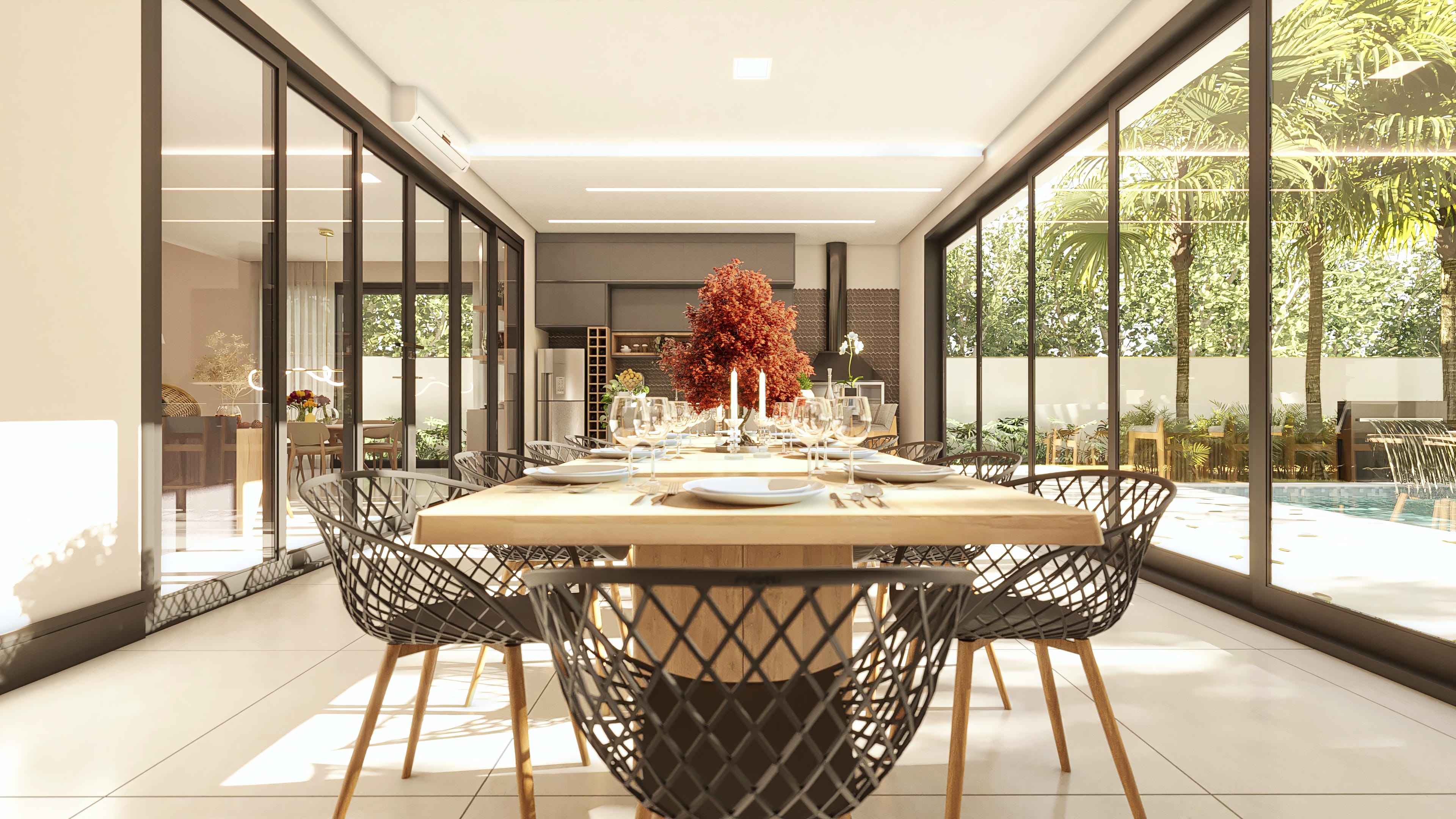 Interior moderno com mesa de jantar ampla, cadeiras com design geométrico e amplas janelas de vidro que conectam com a área gourmet e a piscina.